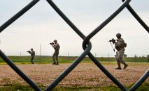 Airmen from the 91st Missile Security Forces Squadron conduct a sweep of a launch facility during a training exercise in North Dakota, July 11, 2014. The exercise is to evaluate the response of infield forces to an attack at a simulated breached site. (U.S. Air Force photo/Senior Airman Brittany Y. Bateman) 