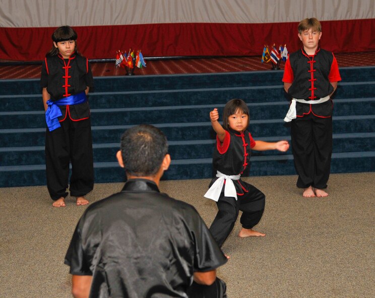 Children from a local Kung-Fu school perform at the Sixth Annual Multicultural Day celebration on Barksdale Air Force Base, La., July 11, 2014. Other dances and demonstrations performed were Egyptian belly dances, a dragon dance and a bachata dance. (U.S. Air Force photo/Airman 1st Class Benjamin Raughton)