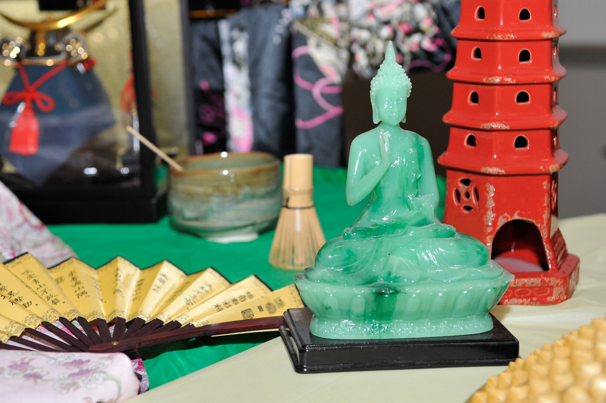 Handcrafted figurines from Asia are on display at the Sixth Annual Multicultural Day celebration, July 11, 2014. Visitors were able to learn about history and culture of different countries and ethnicities by seeing and reading about tools, figures and wares from the various booths. (U.S. Air Force photo/Airman 1st Class Benjamin Raughton)