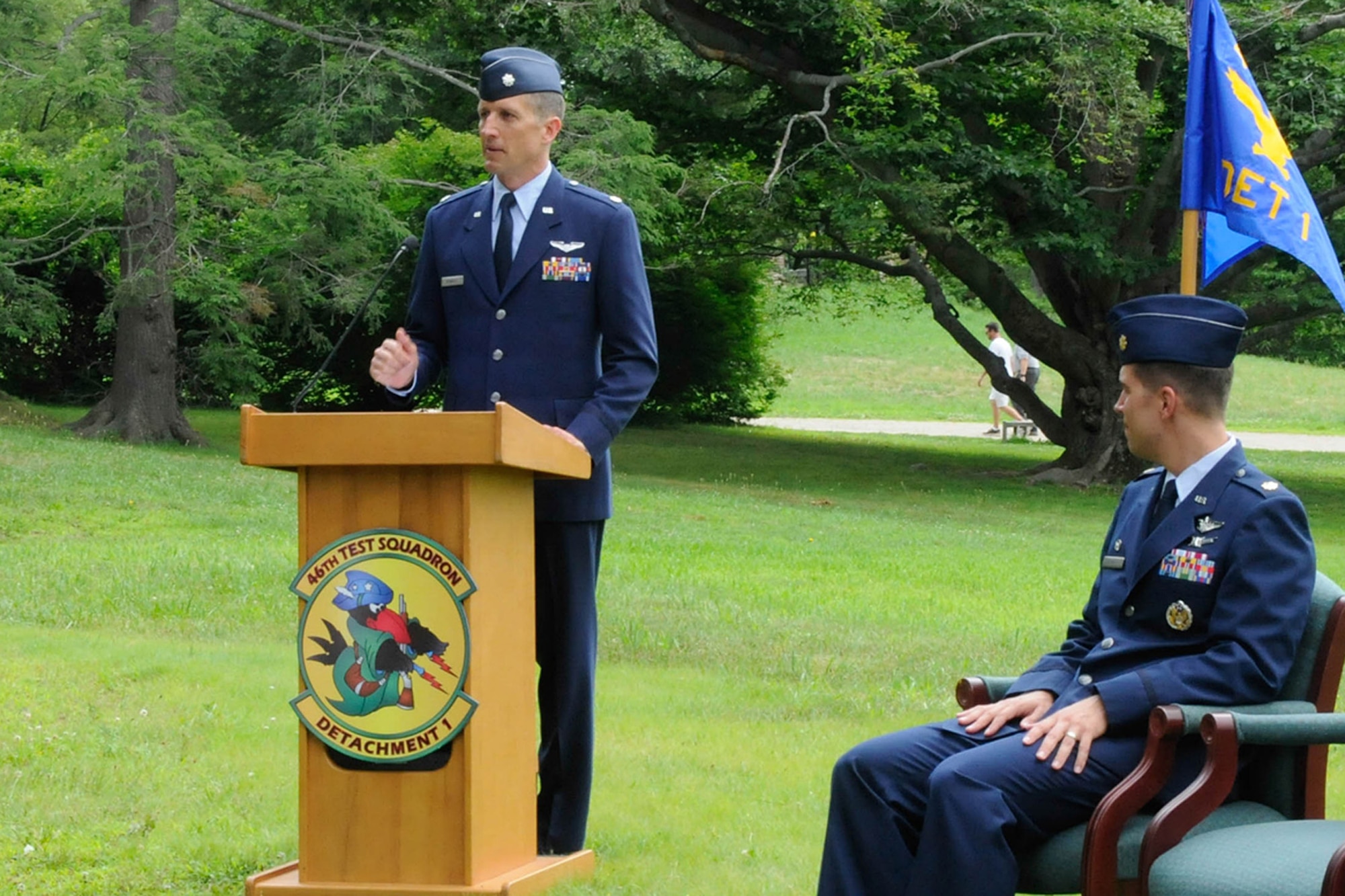 CONCORD, Mass. – Lt. Col. Bradley D. Rennich, new 46th Test Squadron Detachment 1 commander, addresses members of the detachment and invited guests after a transfer of command ceremony at the Old North Bridge here July 15, while Major Gregory A. Grimes, 46th Test Squadron commander, looks on. Rennich replaces Lt. Col. David M. McIllece as commander of the detachment. (U.S. Air Force photo by Linda LaBonte Britt)