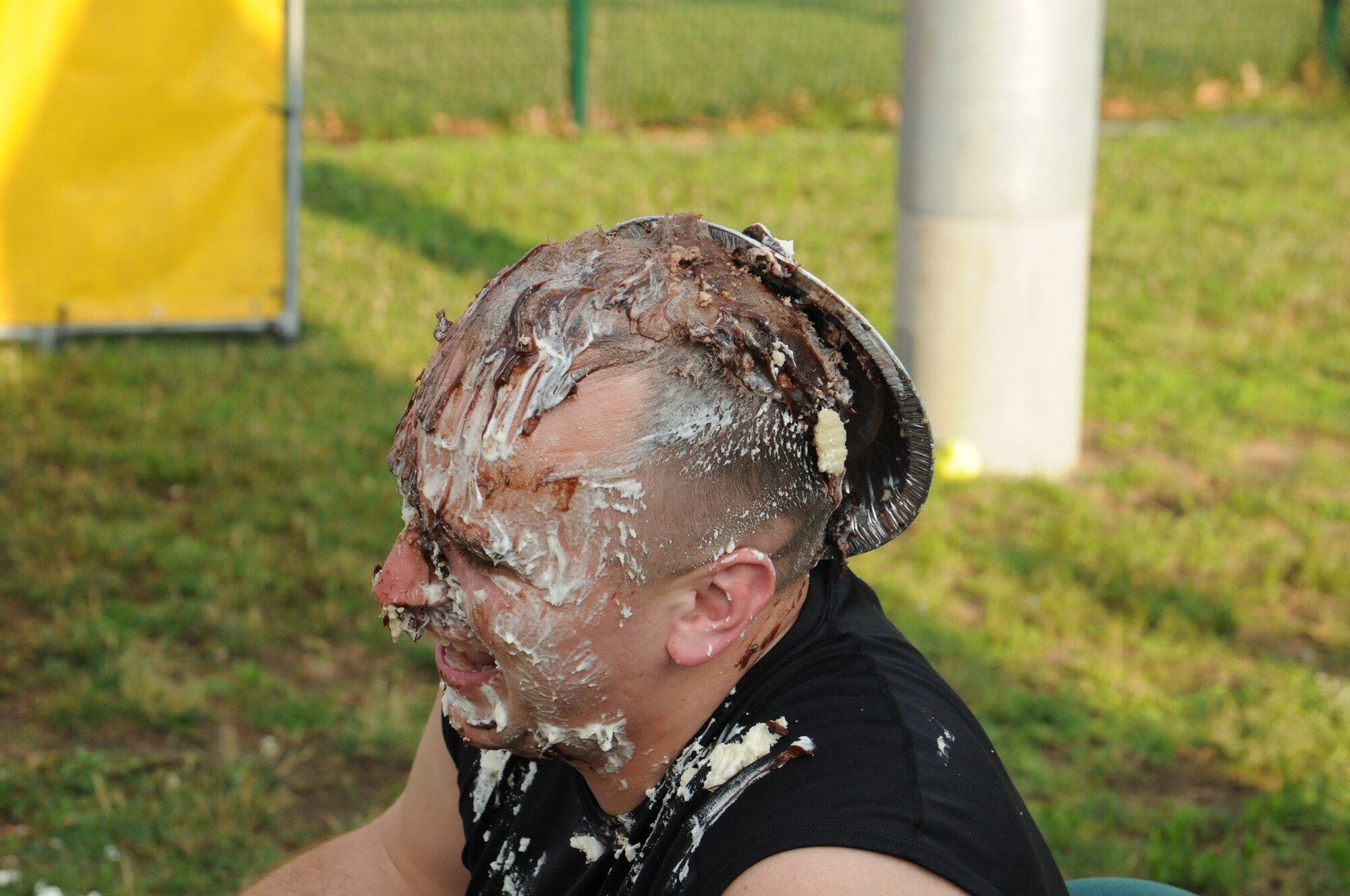 2nd Lt. Steven Marchegiani raised $144 and enjoyed cream and chocolate pie. The Company Grade Officer Council's Pie-in-the-Face contest raised more than $600 for the October ball to help pay for associated costs. (U.S. Air Force photo/TSgt. Brian Boynton)