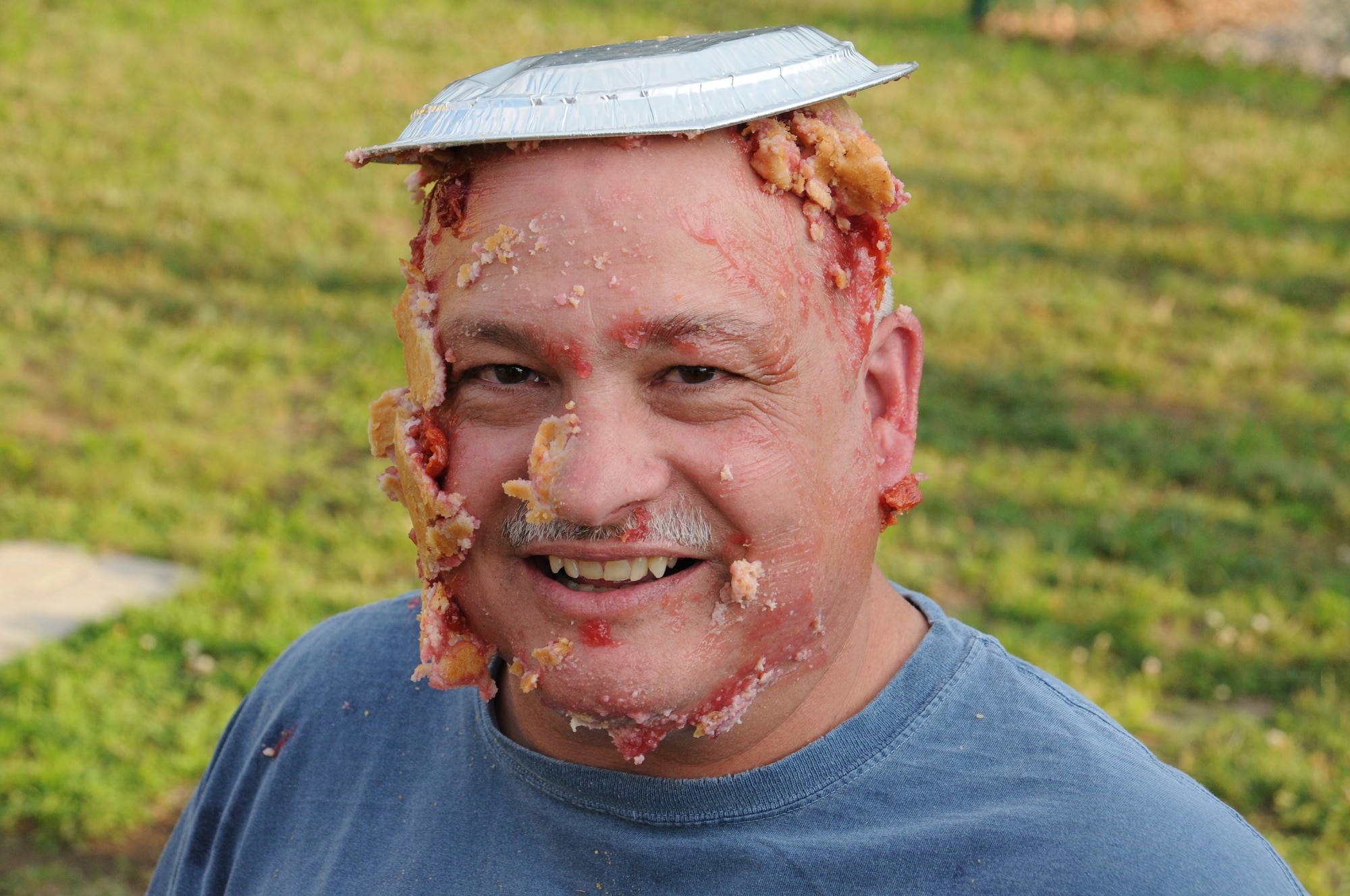 CMSgt. Gary Hebert receives his pie! Chief Hebert won the honors by raising $96. The Company Grade Officer Council's Pie-in-the-Face contest raised more than $600 for the October ball to help pay for associated costs. (U.S. Air Force photo/TSgt. Brian Boynton)