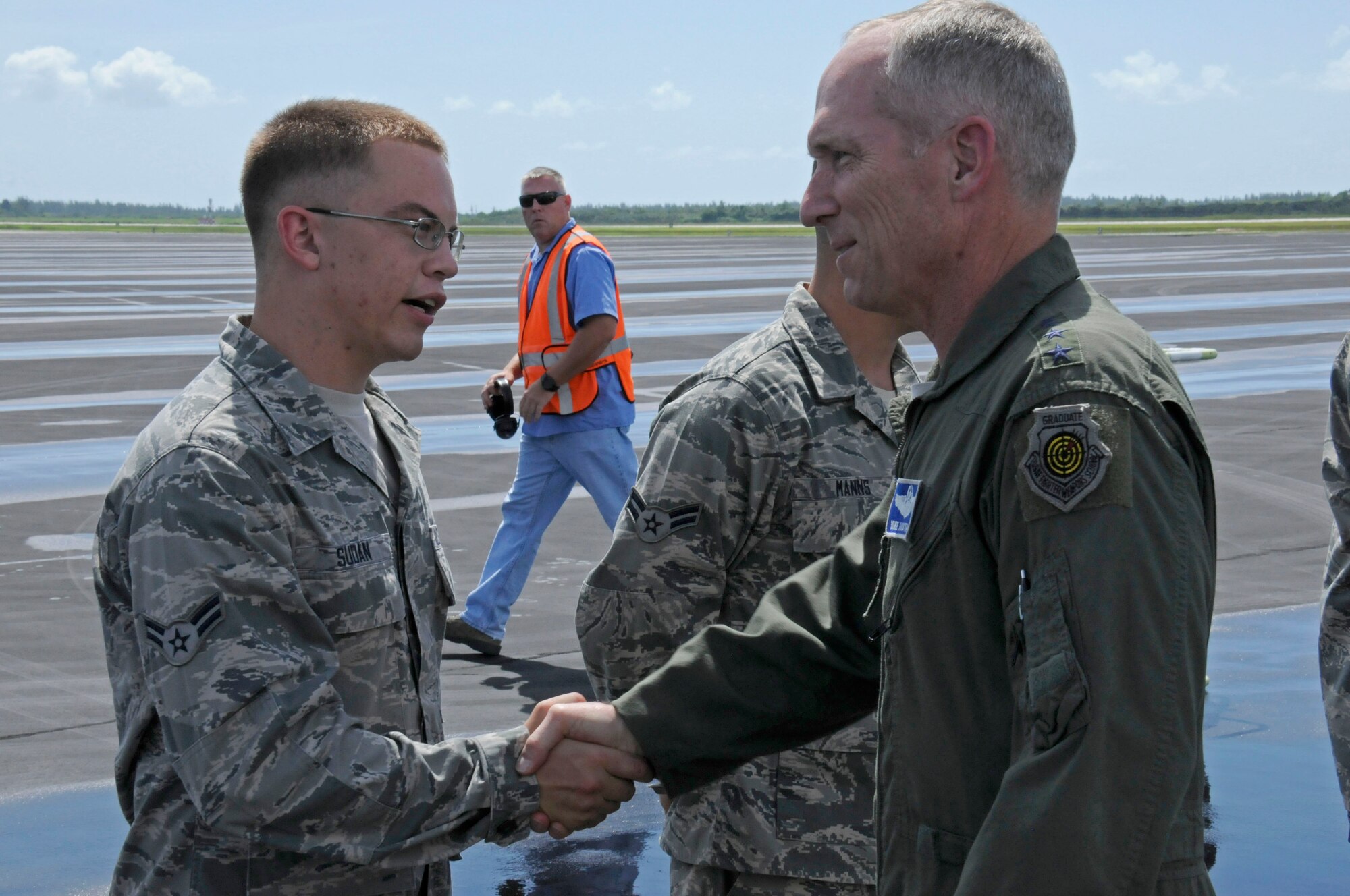 U.S. Air Force Gen. Mike Hostage's, commander of Air Combat Command, shakes
the hands of Airman First Class Thomas Sudan, a member of the Active Duty 495th Fighter Group Det. 93, after landing at Homestead Air Reserve Base, Florida, July 14. During his time here, General Hostage visited organizations of Team Homestead and
toured the local community. (U.S. Air Force photo/Senior Airman Nicholas
Caceres)

