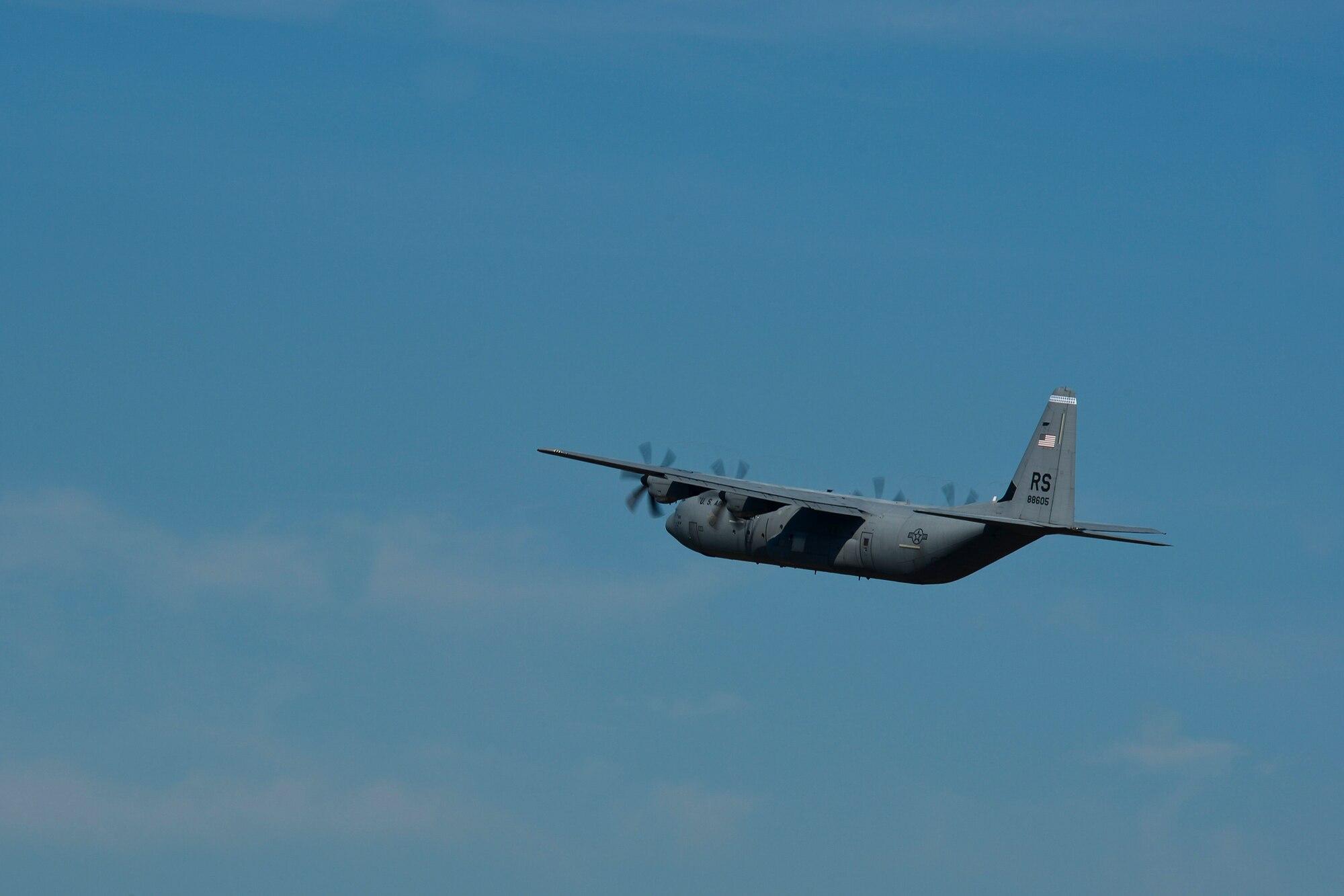 A C-130 Hercules departs Royal Air Force Lakenheath, England, as Airmen assigned to the 48th Security Forces Squadron deploy on July 16, 2014. The 48th SFS Airmen deployed to Djibouti to provide security and protection to Air Force assets. (U.S. Air Force photo by Airman 1st Class Trevor T. McBride/Released)