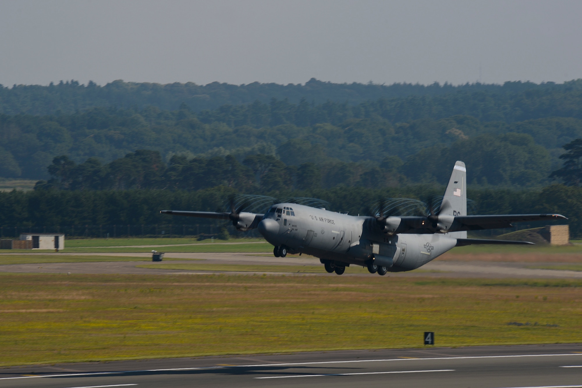 A C-130 Hercules takes flight from Royal Air Force Lakenheath, England, July 16, 2014. Airmen assigned to the 48th Security Forces Squadron deployed to Djibouti to provide security and protection to Air Force assets. (U.S. Air Force photo by Airman 1st Class Trevor T. McBride/Released)