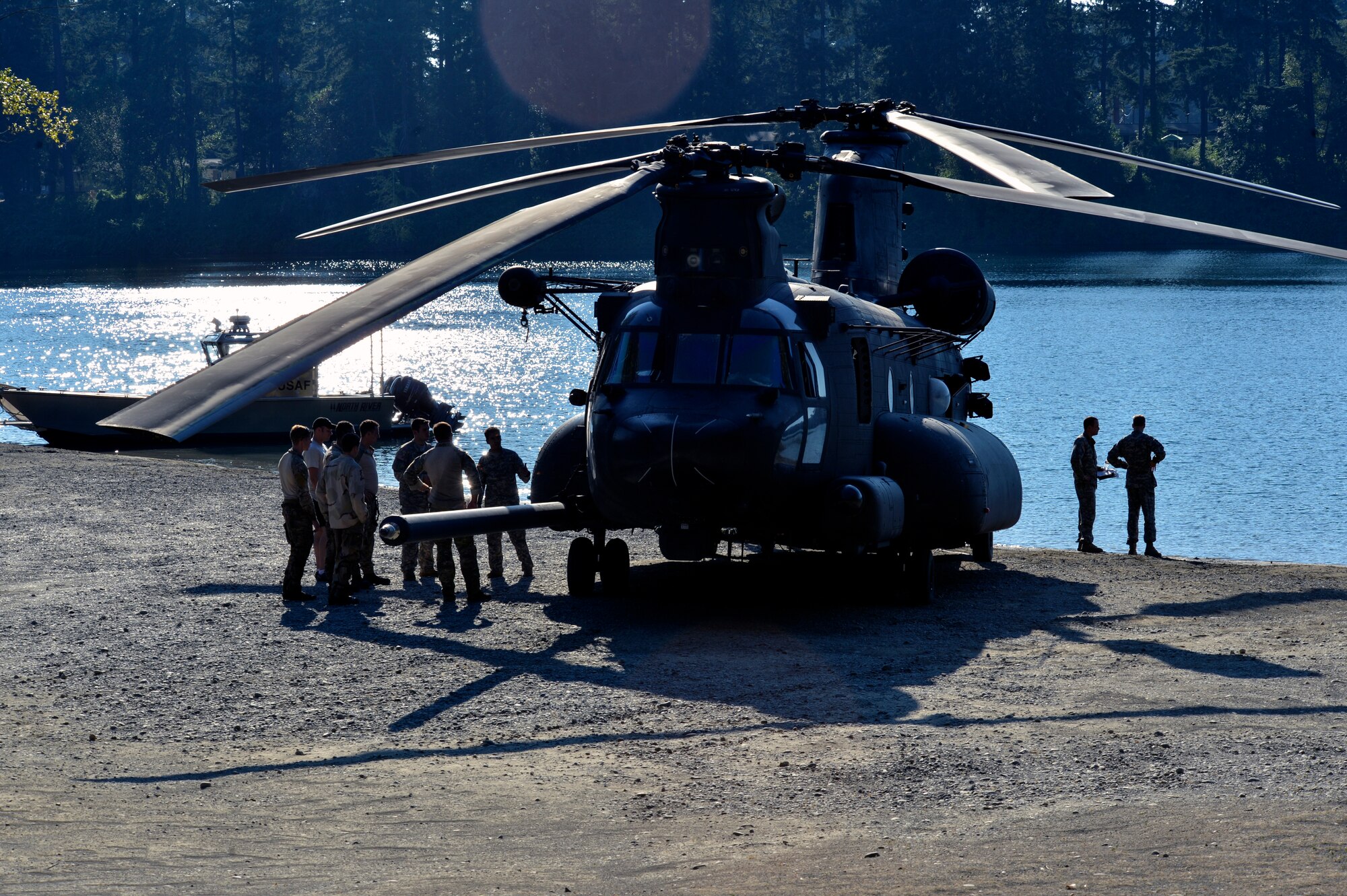 Airmen from McChord Field’s 22nd Special Tactics Squadron’s Red Team are briefed on the features of an MH-47 Chinook helicopter July 14, 2014, by Soldiers from the 160th Special Operations Aviation Regiment at American Lake on Joint Base Lewis-McChord, Wash. The Airmen and Soldiers met face-to-face before conducting day and nighttime helocast operations. (U.S. Air Force photo/Staff Sgt. Russ Jackson)