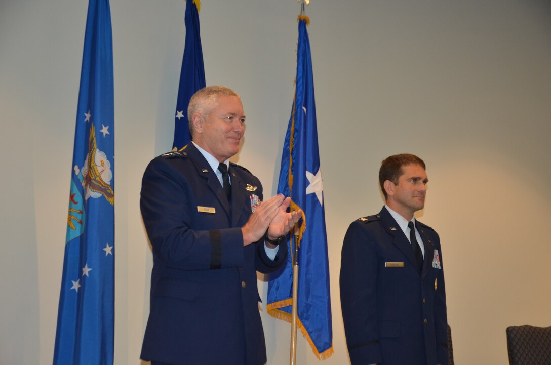 Lt. Gen. William Etter, Commander, Continental U.S. North American Aerospace Defense Region (CONR) - 1st Air Force (Air Forces Northern), applauds during an assumption of command ceremony he presided over July 11 at the Eastern Air Defense Sector.  During the ceremony, Col. Michael Norton assumed command of the EADS organization. (Photo by Maj. Joakim Hansson)