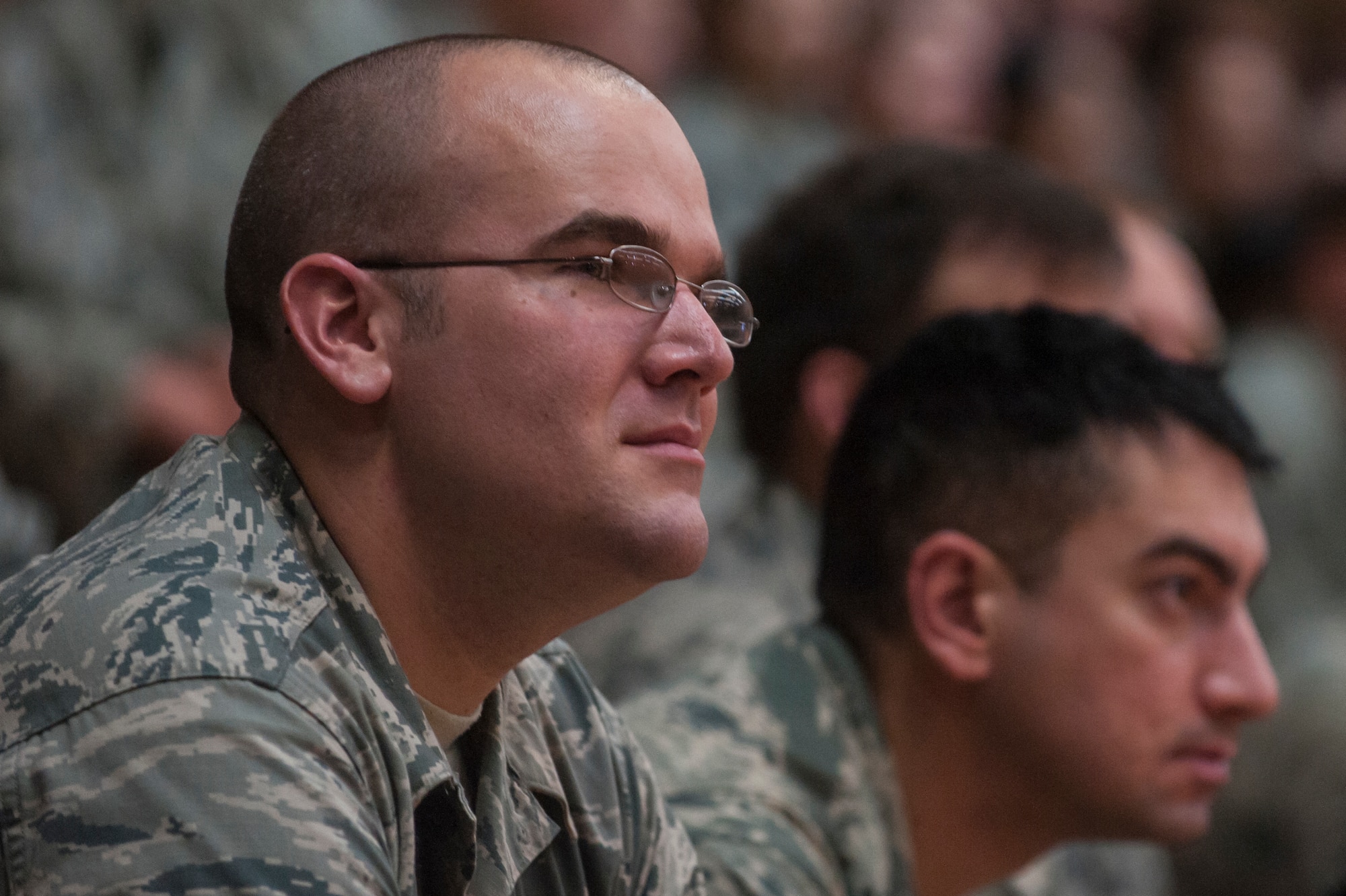 Spangdahlem Airmen listen during the new wing commander's call at the Skelton Memorial Fitness Center July 16, 2014, at Spangdahlem Air Base, Germany. The new leadership talked about their families, background and priorities. (U.S. Air Force photo by Senior Airman Rusty Frank/Released)