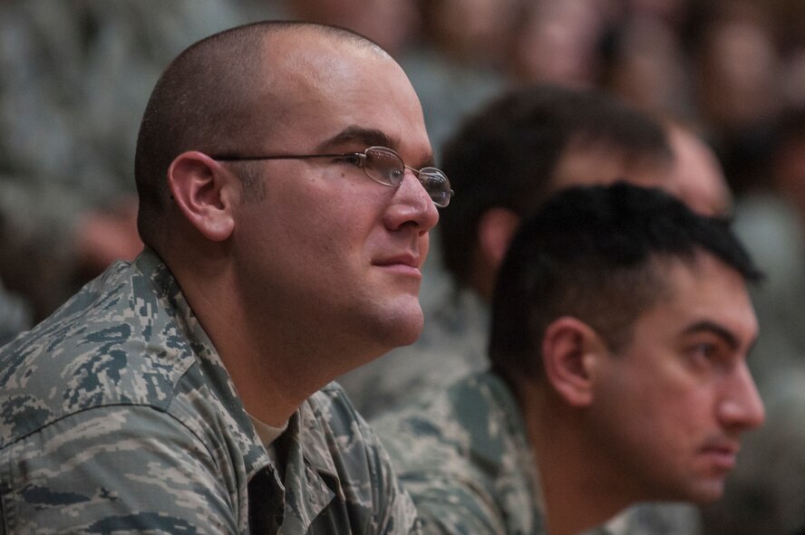 Spangdahlem Airmen listen during the new wing commander's call at the Skelton Memorial Fitness Center July 16, 2014, at Spangdahlem Air Base, Germany. The new leadership talked about their families, background and priorities. (U.S. Air Force photo by Senior Airman Rusty Frank/Released)