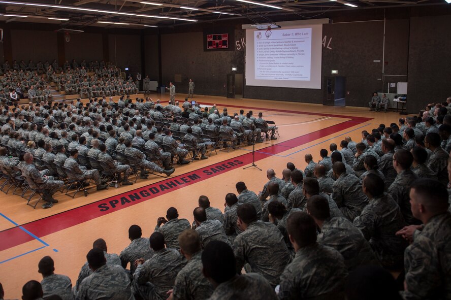 U.S. Air Force Col. Peter Bilodeau, 52nd Fighter Wing commander, speaks during a commander’s call at the Skelton Memorial Fitness Center July 16, 2014, at Spangdahlem Air Base, Germany. Bilodeau and Chief Master Sgt. Brian Gates, 52nd FW command chief, introduced themselves to the base populace and shared their priorities. (U.S. Air Force photo by Senior Airman Rusty Frank/Released)