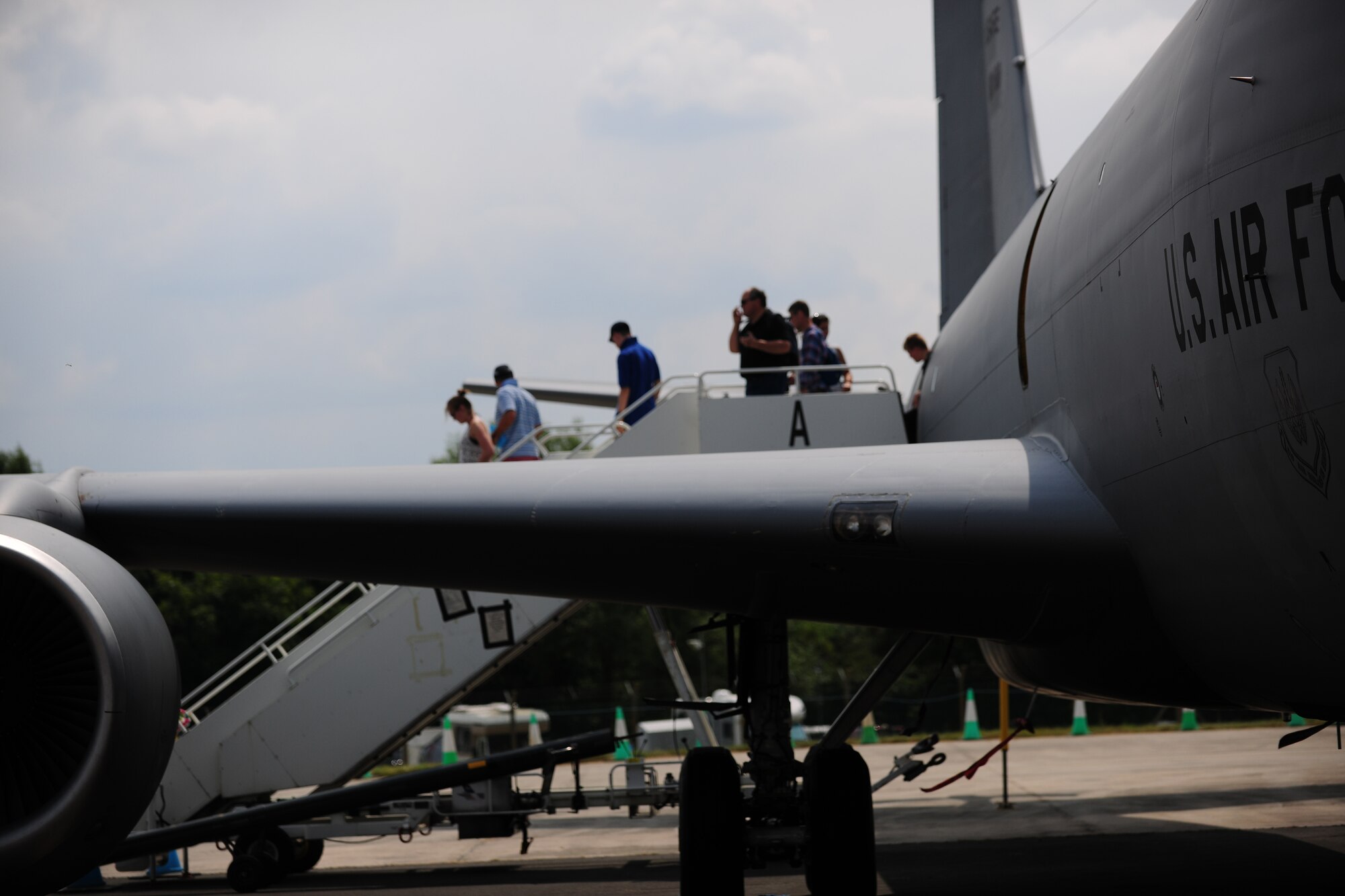 Spectators disembark from a KC-135 Stratotanker during the 2014 Royal International Air Tattoo July 12, 2014, on RAF Fairford, England. The KC-135 was flown from RAF Mildenhall as part of the U.S. military presence at RIAT. This year, RIAT featured numerous international static and flying spectacles, including aircraft from the United States, England and Italy. (U.S. Air Force photo/Staff Sgt. Jarad A. Denton/Released)
