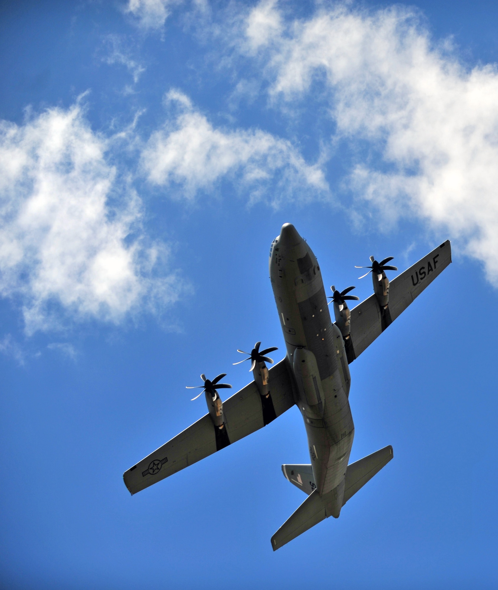 An U.S. Air Force C-130J Super Hercules from Ramstein Air Base, Germany, performs a fly over at Powidz Air Base, Poland, July 11, 2014. Airmen from the 86th Airlift Wing are located in Poland for a forward training deployments employing training events with our NATO allies demonstrating shared commitments to peace. (U.S. Air Force photo by Senior Airman Christine Griffiths/Released)