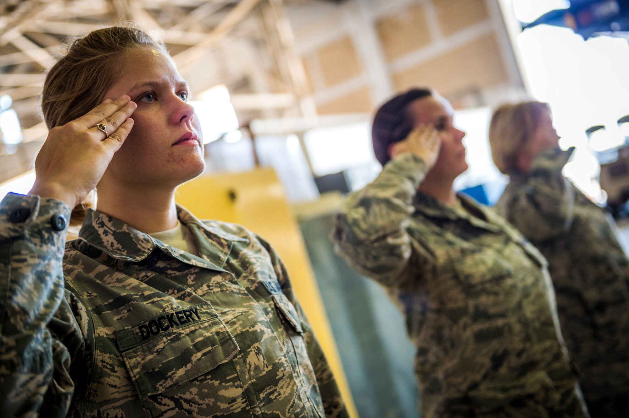 Staff Sgt. Kari Dockery, 387th Expeditionary Support Squadron force protection NCO, salutes during a dignified transfer practice July 12, 2014 at an undisclosed location in Southwest Asia. Dockery the other airmen train to handle those who have fallen in the line of duty with dignity and respect as they make their journey home to their families. These Airmen are available 24 hours, seven days a week for any dignified transfer. She is deployed from Edwards Air Force Base, Calif. in support of Operation Enduring Freedom. (U.S. Air Force photo by Staff Sgt. Jeremy Bowcock)