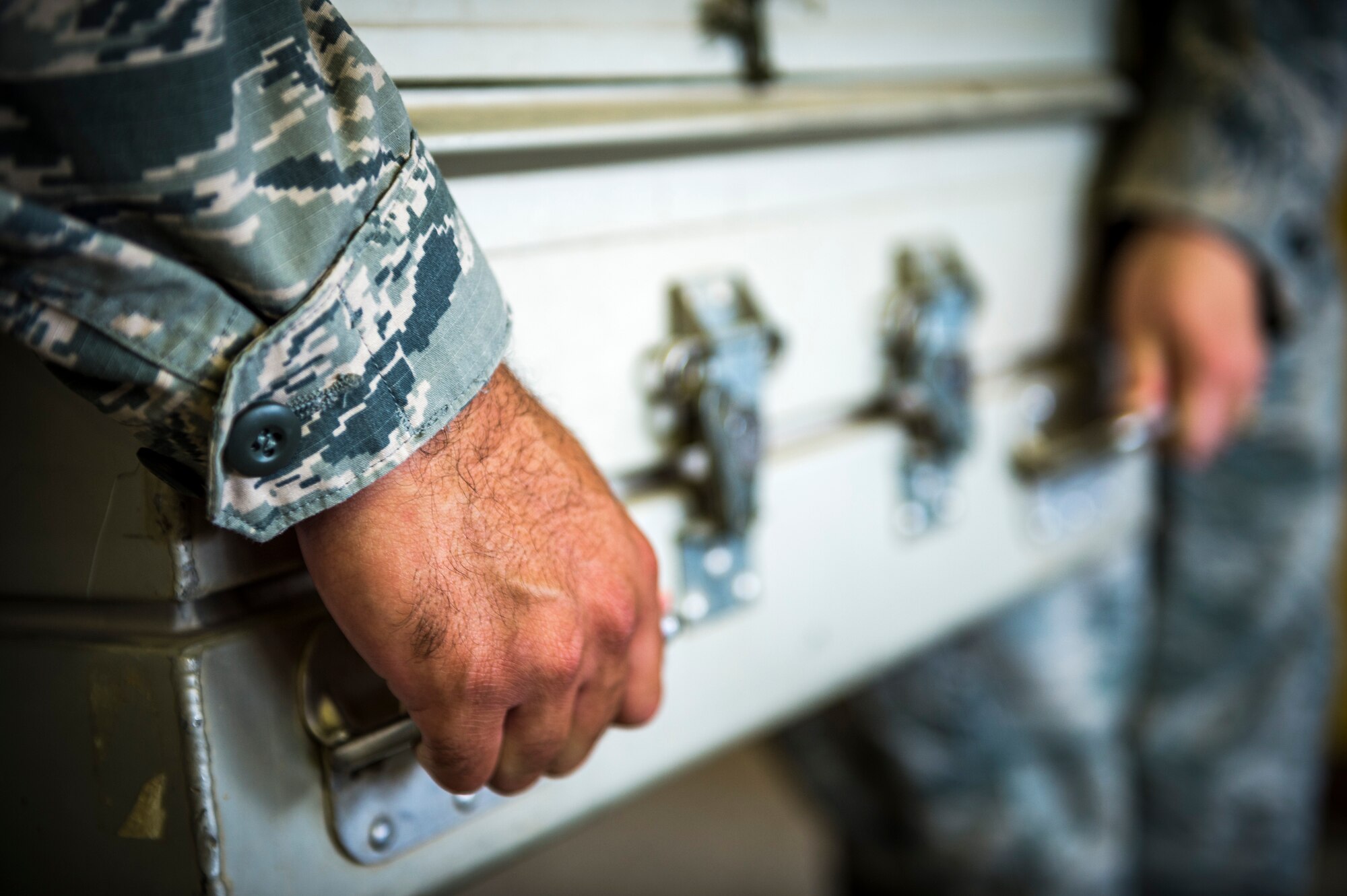 Airmen from the 387th Expeditionary Support Squadron practice for dignified transfers July 12, 2014 at an undisclosed location in Southwest Asia. These airmen train to handle those who have fallen in the line of duty with dignity and respect as they make their journey home to their families. These Airmen are available 24 hours, seven days a week for any dignified transfer.(U.S. Air Force photo by Staff Sgt. Jeremy Bowcock)