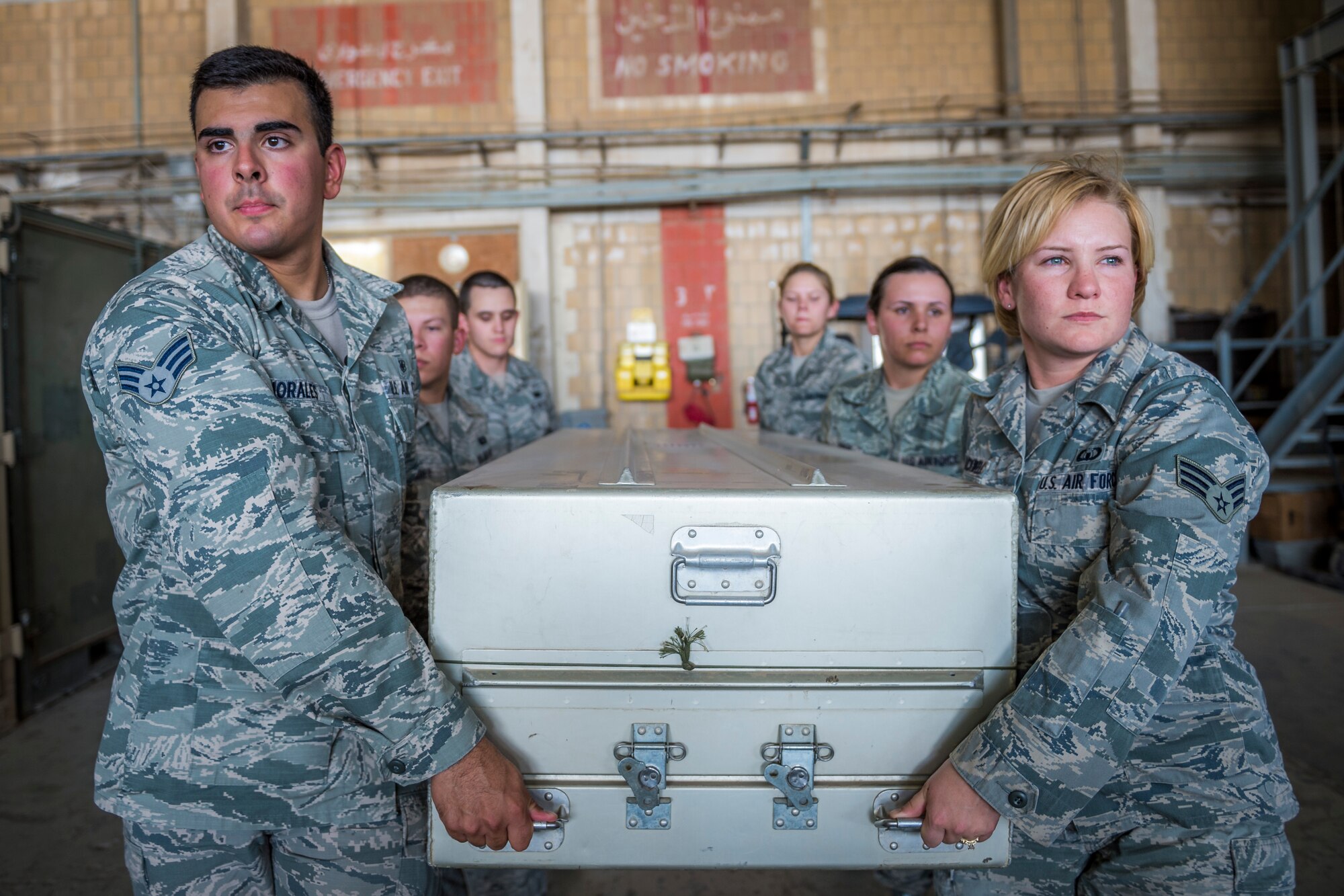 Airmen from the 387th Expeditionary Support Squadron practice for dignified transfers July 12, 2014 at an undisclosed location in Southwest Asia. These airmen train to handle those who have fallen in the line of duty with dignity and respect as they make their journey home to their families. Senior Airman Julio Morales has been the dignified transfer program director for the past five months and deployed here from Lackland Air Force Base, Texas in support of Operation Enduring Freedom. These Airmen are available 24 hours, seven days a week for any dignified transfer.(U.S. Air Force photo by Staff Sgt. Jeremy Bowcock)