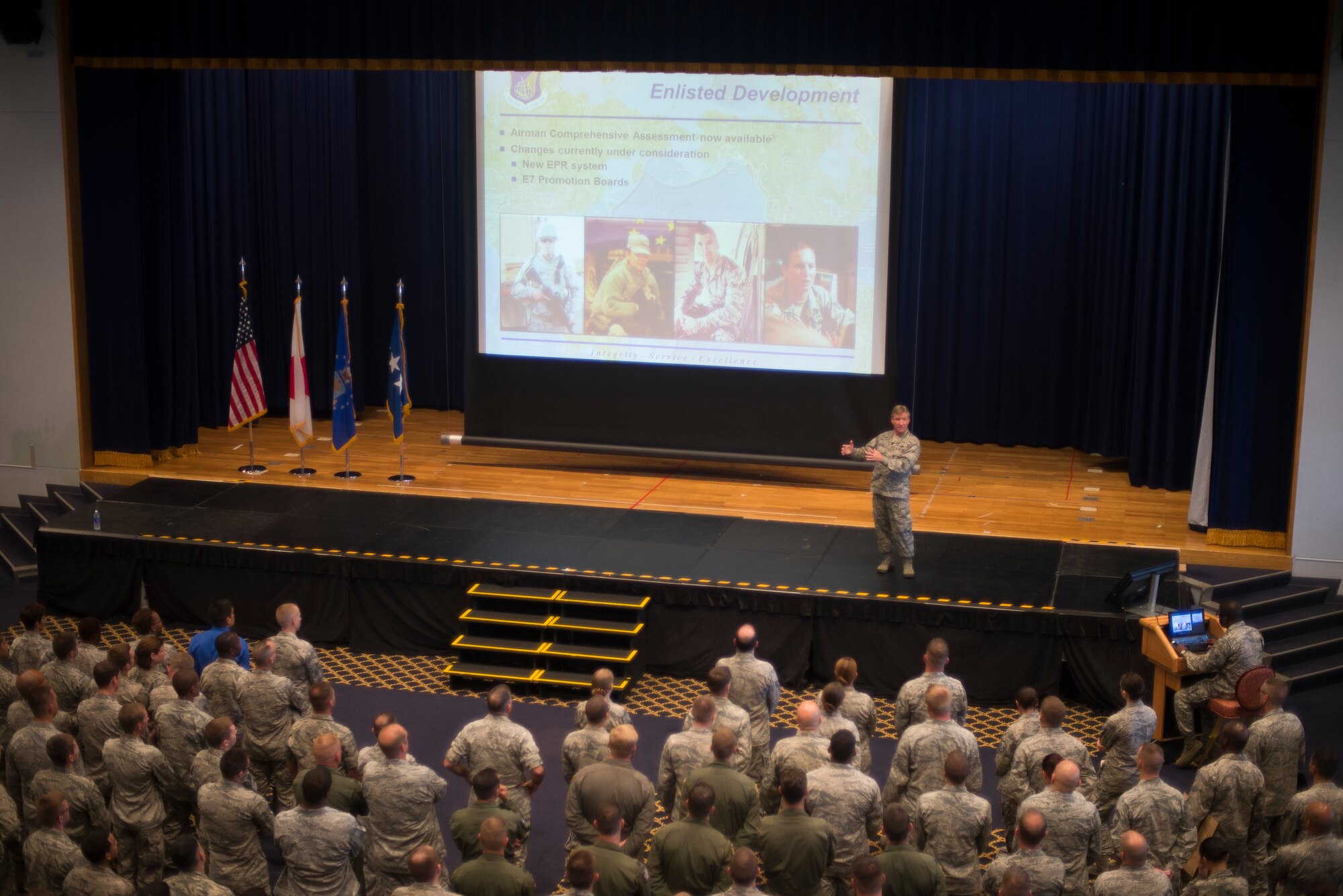 Gen. Hawk Carlisle, Pacific Air Forces commander, addresses Yokota Airmen during an all call at Yokota Air Base, Japan, July 14, 2014. Carlisle informed Airmen of upcoming Air Force changes and recognized several Airmen. (U.S. Air Force photo by Staff Sgt. Chad C. Strohmeyer/Released)