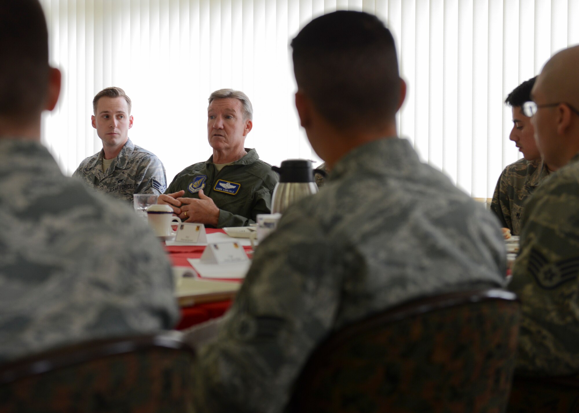 Gen. Hawk Carlisle, Pacific Forces commander, meets with Airmen during breakfast at Yokota Air Force Base, July 13, 2014. Carlisle spent two days at Yokota to meet with Airmen and hosted an all call to address upcoming Air Force changes and thank his fellow Airmen for their hard work throughout the year. (U.S. Air Force photo by Airman 1st Class Meagan Schutter/Released)