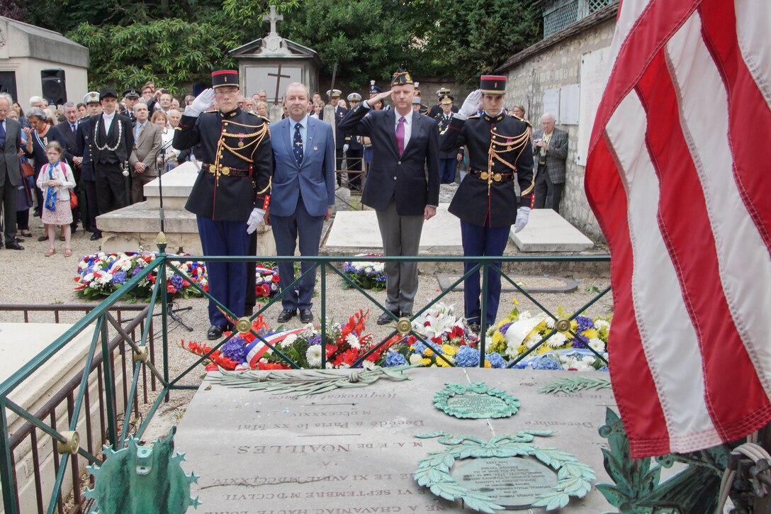 An American flag is lowered during an annual commemorative ceremony at the tomb of Maj. Gen. Marquis de Lafayette July 4. Each year, on America's Independence Day, French and American military personnel, dignitaries and societies place wreaths at the edge of Lafayette's tomb and lower the American flag, which is flown above the grave. The flag is then replaced, raised and flown until the ensuing year's ceremony. The memorial event, which began after World War I, honors Lafayette for his roles in both American and French conflicts such as the American War of Independence and the French Revolution.