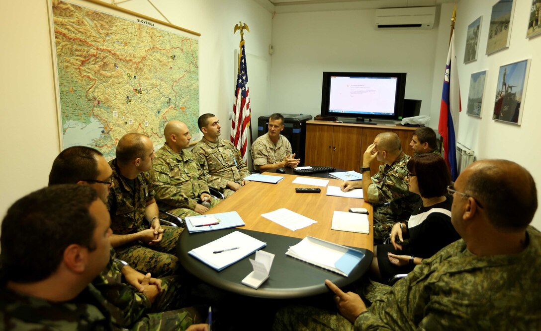 Maj. Greg Lewis, transportation manager for Marine Corps Logistics Operations Group, discusses airlift options during a logistics conference at the Slovenian Ministry of Defense in Ljubljana, Slovenia, July 3. The conference discussed logistic planning and structure as well as a cooperative session to plan historical natural disaster relief.