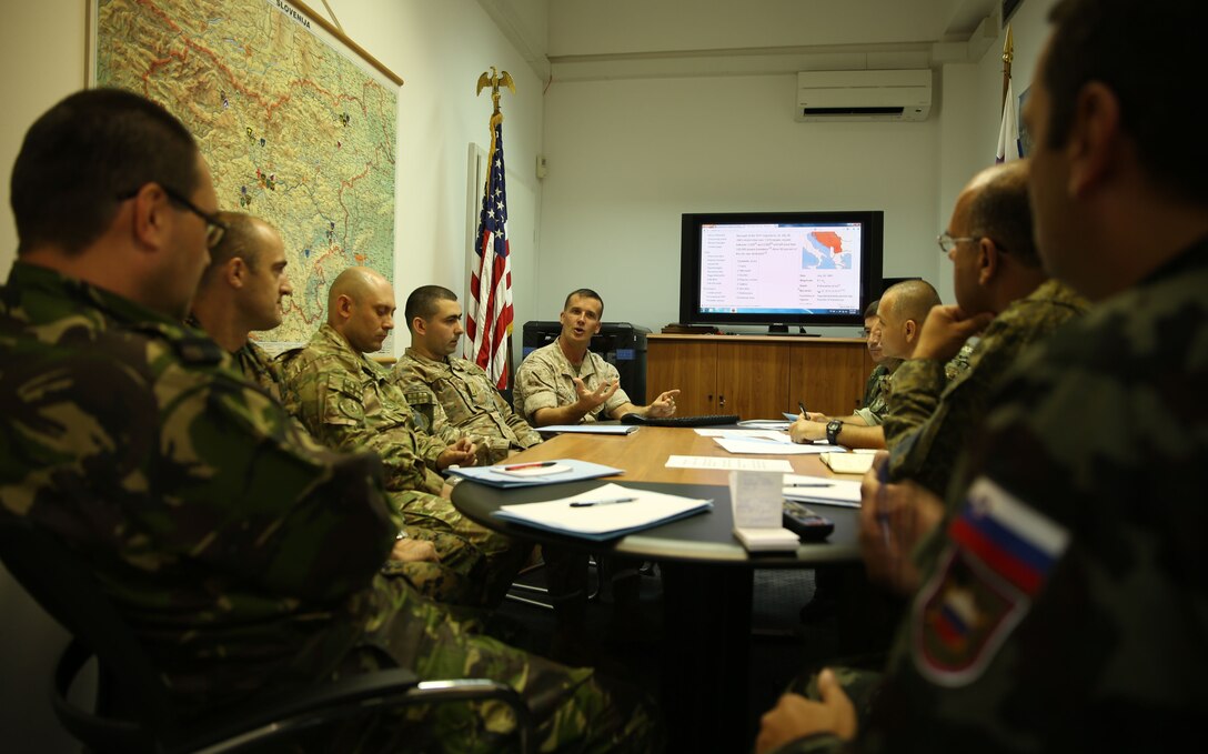 Maj. Greg Lewis, transportation manager for Marine Corps Logistics Operations Group, discusses airlift options during a logistics conference at the Slovenian Ministry of Defense in Ljubljana, Slovenia, July 3. The conference discussed logistic planning and structure as well as a cooperative session to plan historical natural disaster relief.