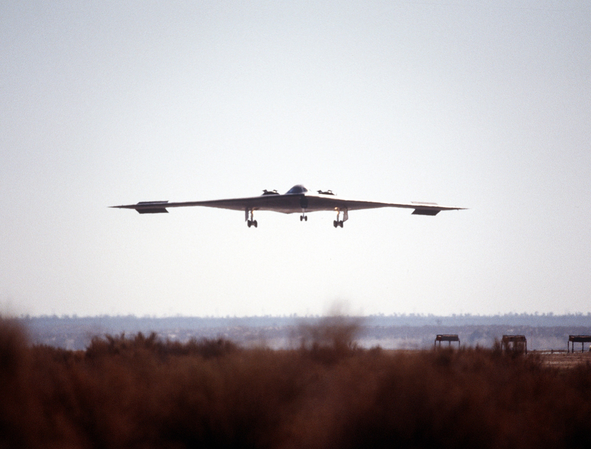 A B-2 Spirit bomber lines up on the runway July 17, 1989, at the Northrop Grumman production facility in Palmdale, Calif. The first flight was just over two hours long, and ended at Edwards Air Force Base, Calif, where the aircraft underwent further testing both on the ground and in the air. (Defense Imagery Management Operations Center)