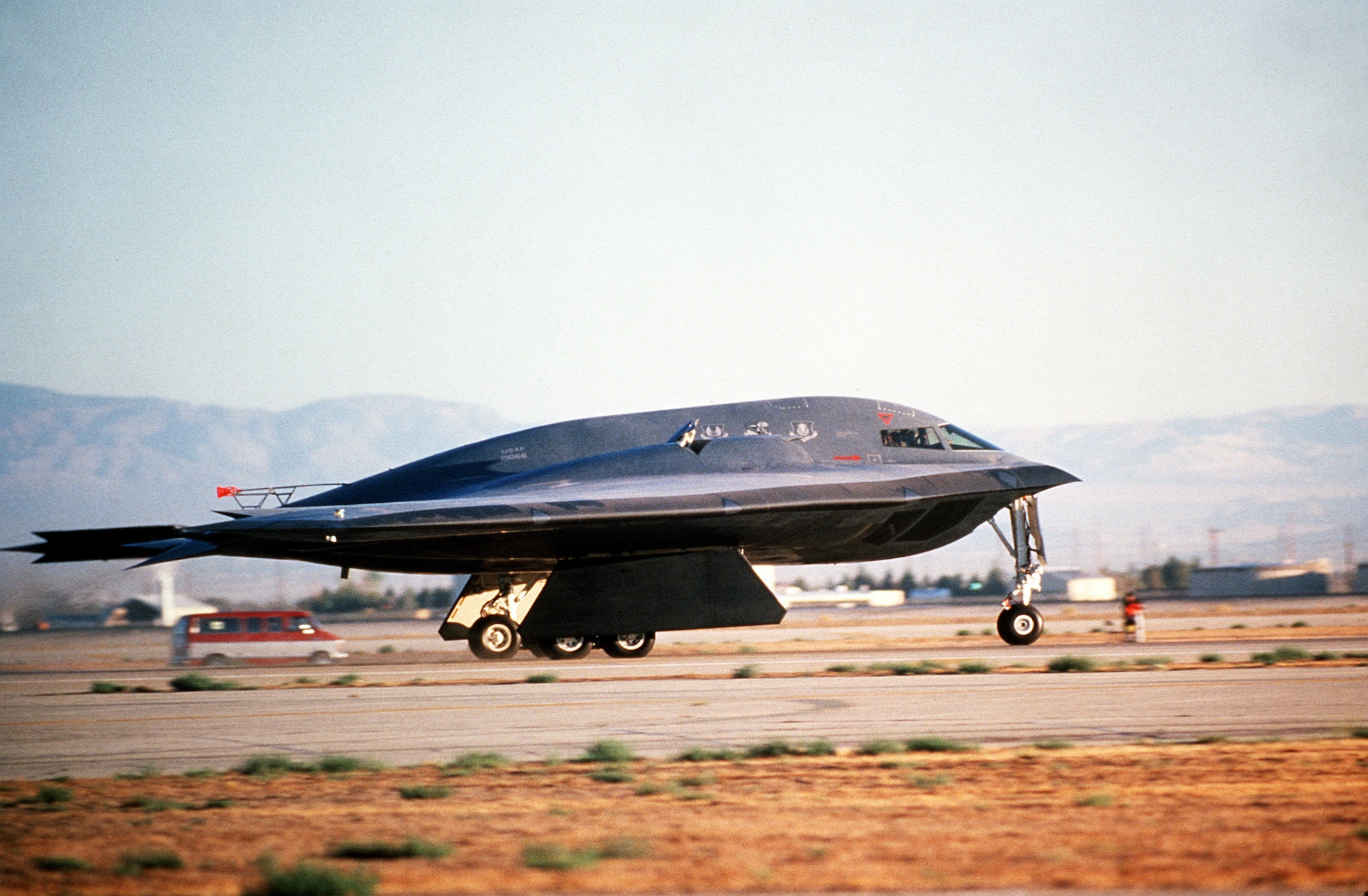 A B-2 Spirit bomber takes off July 17, 1989, from the Northrop Grumman production facility in Palmdale, California on its inaugural flight to Edwards Air Force Base, Calif. The B-2 would remain in the testing phase until 1993, when the first operational aircraft was delivered to Whiteman AFB, Mo. (Defense Imagery Management Operations Center)