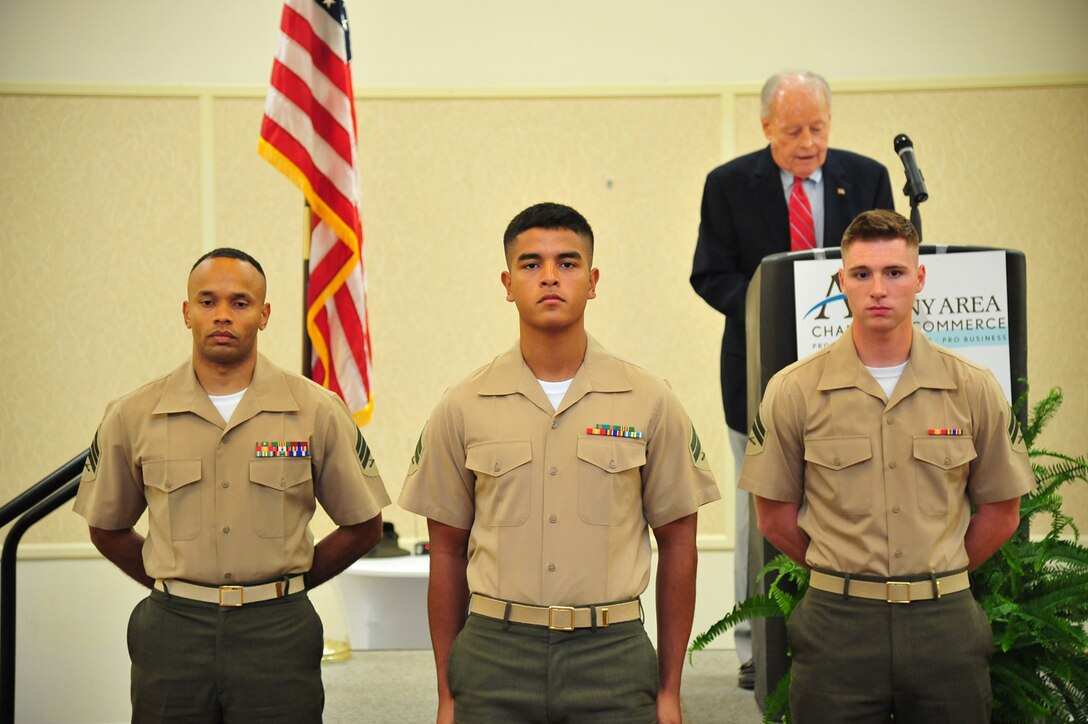 In appreciation for their service and achievement, three Marines were honored and presented awards and a gift for Marine and Noncommissioned Officer of the Year. Pictured from left: NCO of the Year, Sgt. Johnnie Encarnacion, contract specialist, Marine Corps Logistics Command; Marine of the Year, Cpl. Fabio Chapina-Rodriguez, basic machinist, LOGCOM, and Marine of the Year, Cpl. Jacob Jones, travel clerk, Logistics Support Division, Marine Corps Logistics Base Albany. Not pictured: NCO of the Year, Sgt. Stephanie Bowens, postal clerk, MCLB Albany.