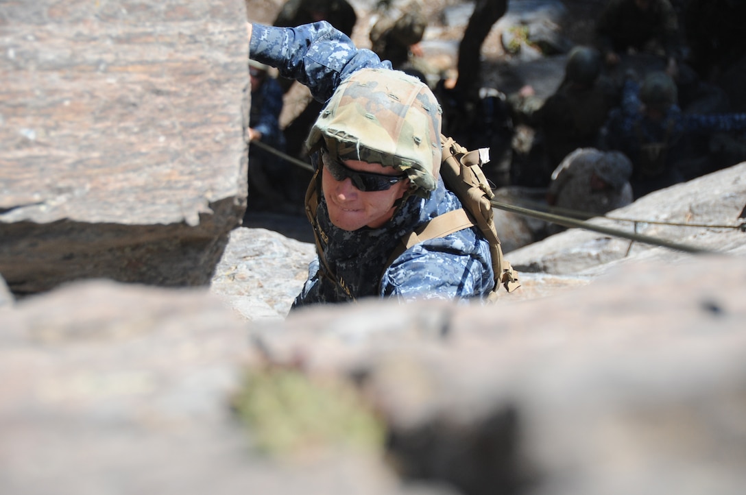 U.S. Naval Academy Midshipman 2nd Class Alejandro Fernandez climbs up a rock face at Marine Corps Mountain Warfare Training Center, Bridgeport, Calif., July 14.  Fernandez is one of 155 midshipmen training at MCMWTC.  The midshipmen spend 10 days at MCMWTC learning survival and tactical skills in a mountainous environment for summer training. (Official U.S. Navy photo by Lt. Matthew Comer)