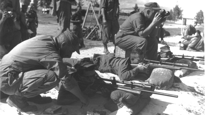 Marine Corps scout snipers sight in during training in Vietnam. The first Marine Corps scout sniper platoon to be trained exclusively in combat would later be nicknamed ‘the Rogues.’ (Photo courtesy of Walt Sides)