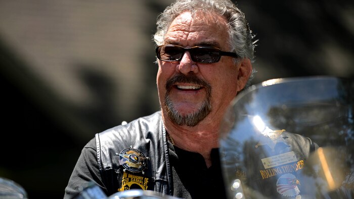 Walt Sides, a retired Marine, sits on his motorcycle in front of his ranch in Leesburg, Virginia July 10, 2014. Sides is a co-founder and the executive director of Rolling Thunder Washington D.C. Incorporated.