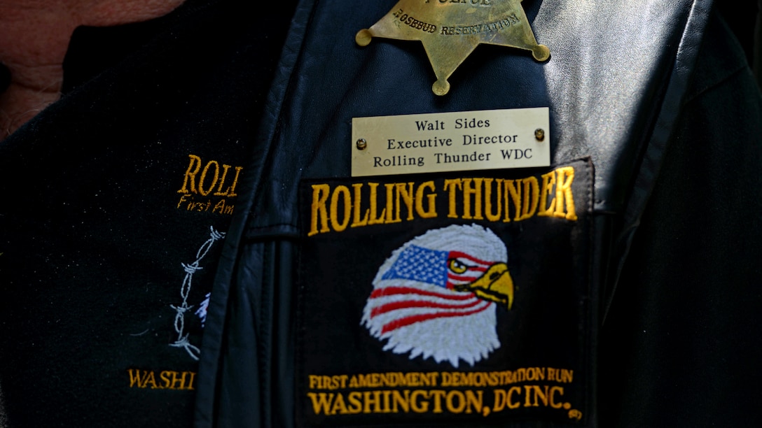 Walt Sides, a retired Marine, shows off his Rolling Thunder motorcycle vest July 10, 2014. Rolling Thunder Washington D.C. Incorporated was created in 1987, to spread awareness of Prisoner of War and Missing In Action issues.