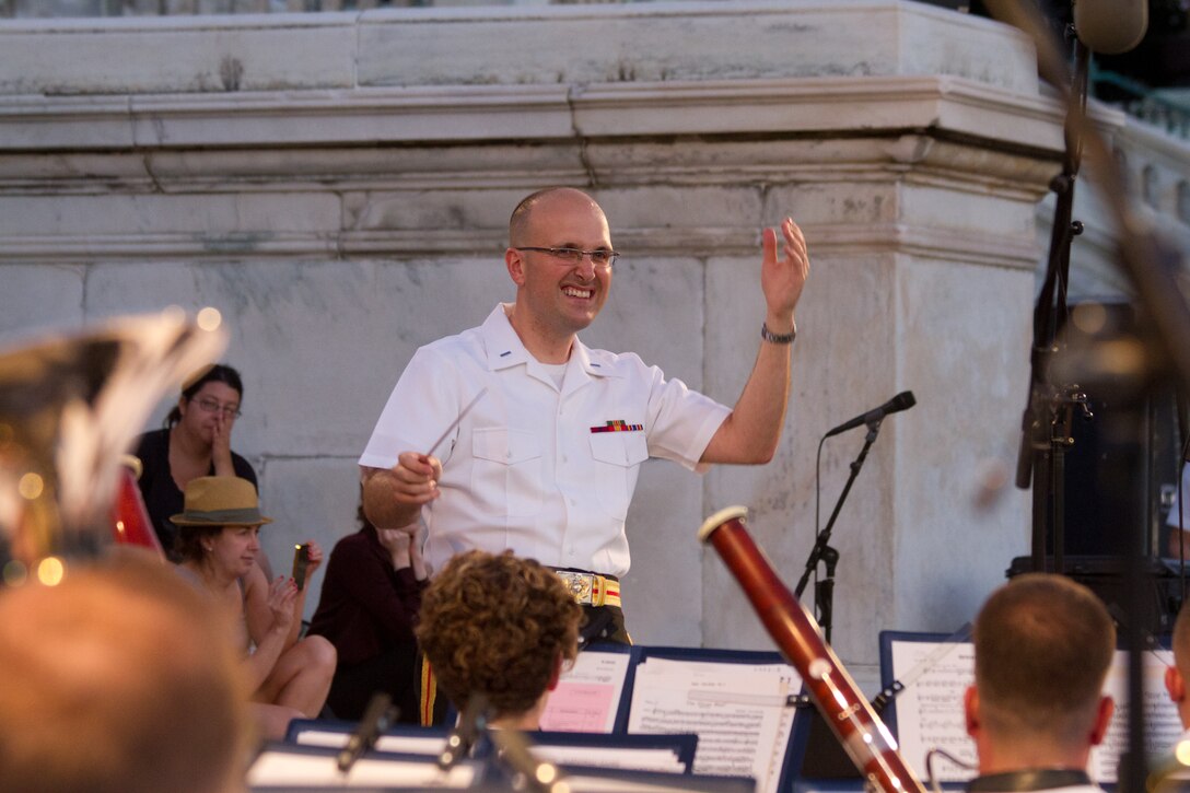 On July 16, 2014, at the U.S. Capitol in Washington, D.C., 1st Lt. Ryan J. Nowlin conducted his first concert as an assistant director. The program include marches by John Philip Sousa and Henry Fillmore, Gustav Holst's Suite in F for Military Band, and Carmen Dragon's arrangement of Samuel Augustus Ward's "America, the Beautiful." (U.S. Marine Corps photo by GySgt Amanda Simmons/released)