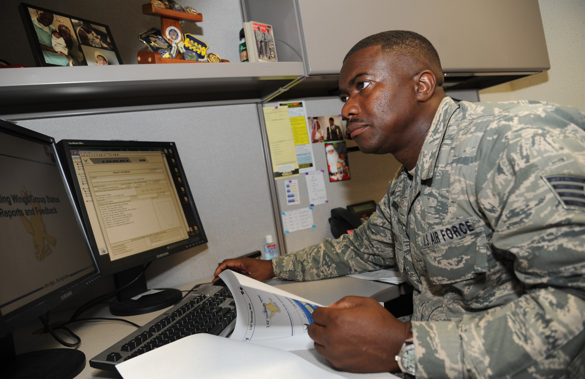 Staff Sgt. Joseph Boyou, 2nd Air Force, reviews slides for a final review session for 2nd AF, 81st Training Wing and the 81st Training Group July 1, 2014, at Keesler Air Force Base, Miss. Boyou was born in Liberia, West Africa and escaped the civil war there when he was a child. Boyou wrote a memoir telling his story of overcoming adversity. It is scheduled to be released later this summer. (U.S. Air Force photo by Kemberly Groue)