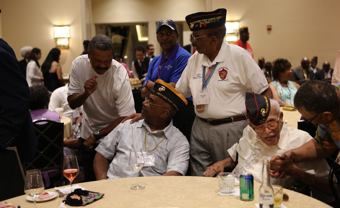 Montford Point Marines gather together for the presentation of the Congressional Gold Medal to deceased Montford Point Marines Charles E. Allen and Lawrence Gabriel, July 16, 2014. Family members accepted the medals on behalf of the Marines, during the National Montford Point Marine Association’s 49th Annual National Convention. Montford Point Marines as well as active duty and Reserve Marines will attend different seminars during the conference to help educate and redirect the efforts of the association.