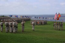 Marines and sailors with 2nd Marine Logistics Group salute the colors during the change of command ceremony for 2nd MLG aboard Camp Lejeune, N.C., July 15, 2014. During the ceremony, Brig. Gen. Charles G. Chiarotti assumed command of 2nd MLG from Brig. Gen. Edward D. Banta. 