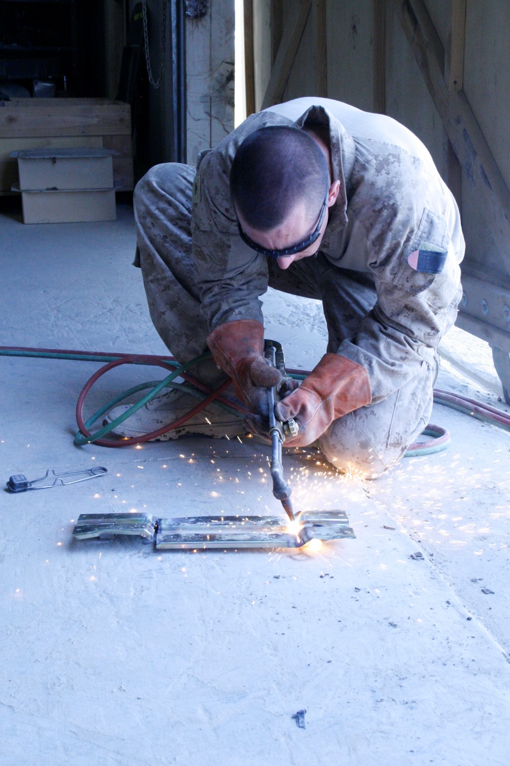 Lance Cpl. Zachary Graybill, a motor transport mechanic with 1st Battalion, 2nd Marine Regiment, welds a piece of metal aboard Camp Leatherneck, Helmand province, Afghanistan, July 11, 2014. Graybill, a native of Duncannon, Pennsylvania, is one of the mechanics responsible for ensuring vehicles run properly and effectively in order to complete the mission for coalition forces serving with Regional Command (Southwest).