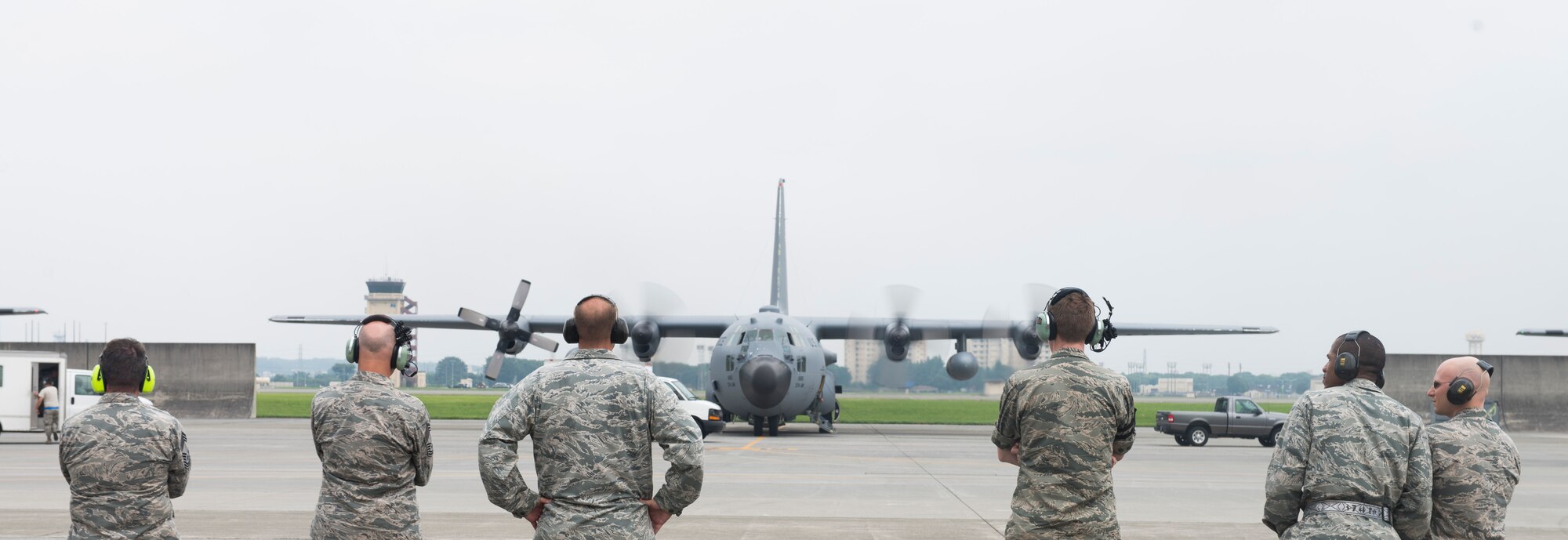 YOKOTA AIR BASE, Japan -- Airmen wait for aircrew and maintenance to finish preflight checks during routine operations at Yokota July 17, 2014. The 374 AW provides tactical combat mobility and humanitarian aid capabilities as the primary airlift hub in the Pacific region. (U.S. Air Force photo by Airman 1st Class David D. Danford/Released)
