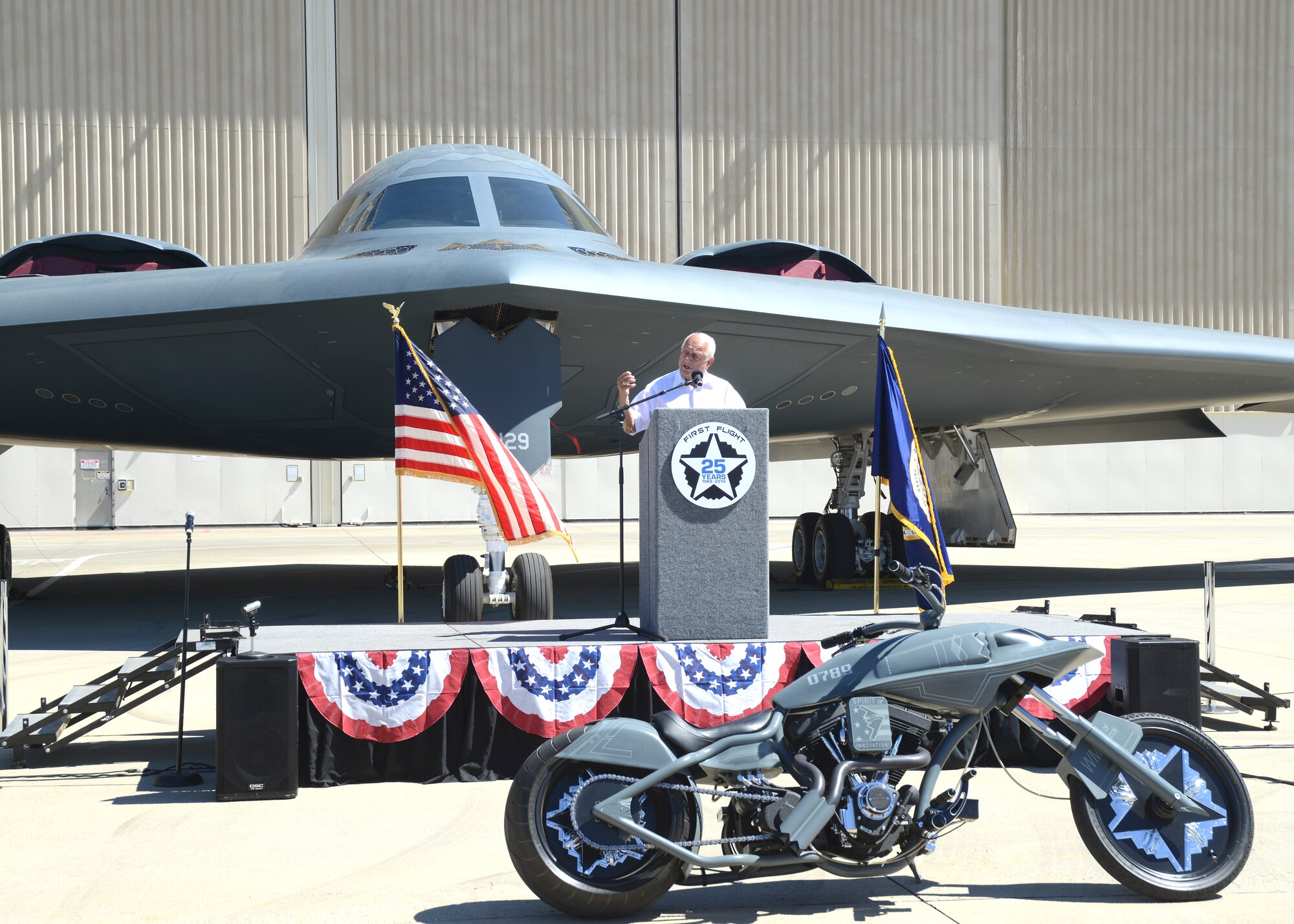 Former L.A. Dodgers great, Tommy Lasorda, was one of the guest speakers at the celebration of the 25th anniversary of the first flight of the B-2 Spirit July 17 at U.S. Air Force Plant 42. The Stealth Bomber made it's first flight July 17, 1989 from Palmdale, Calif. In the foreground sits the B-2 Stealth Bike, a custom motorcycle commissioned by Northrop Grumman to be built for the 20th anniversary of the Spirit's first flight. (U.S. Air Force photo by Kenji Thuloweit)