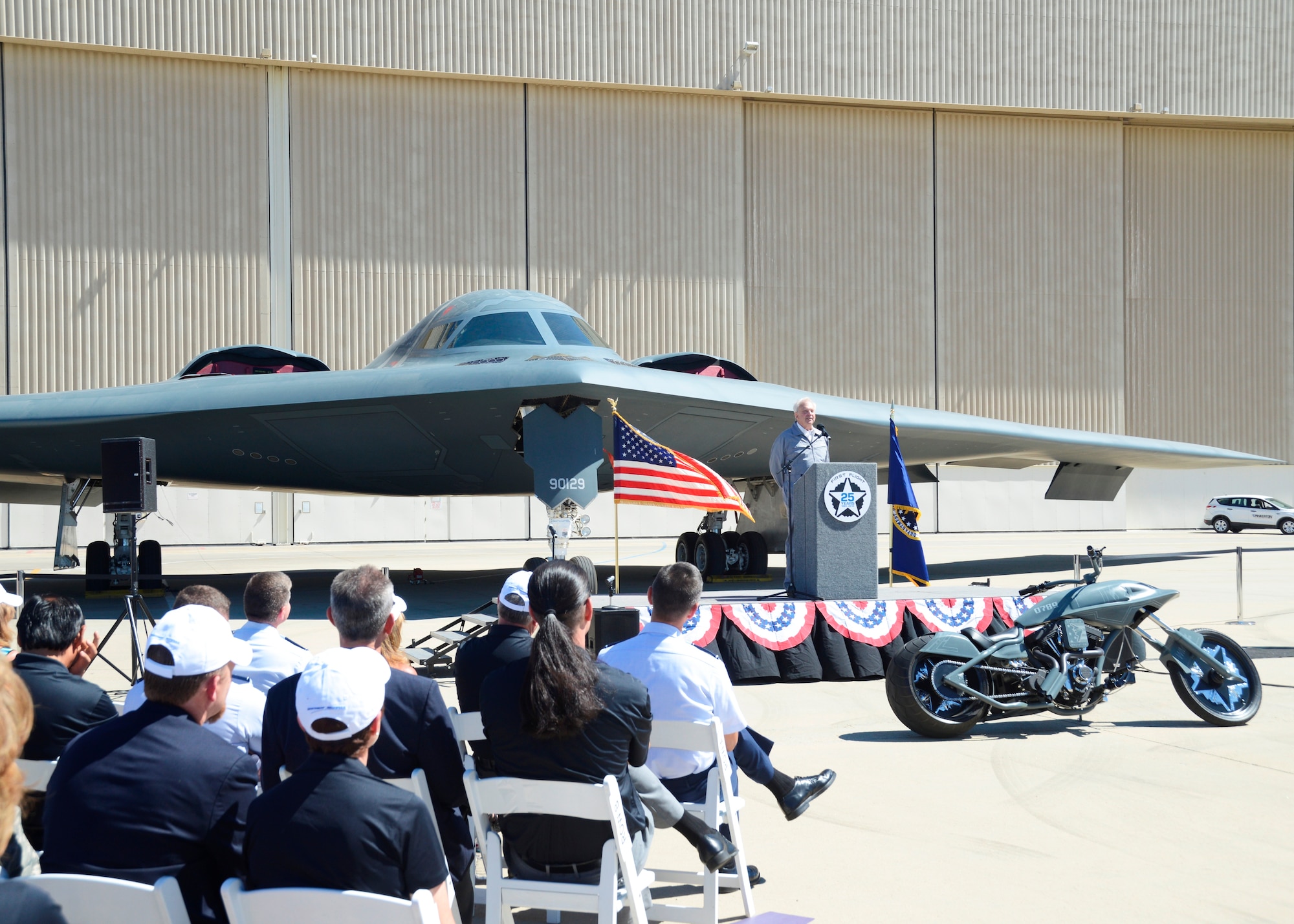 Bruce Hinds, chief test pilot on the first flight of the B-2 Spirit on July 17, 1989, speaks to the crowd about the flight and his role in the development of the Stealth Bomber.(U.S. Air Force photo by Kenji Thuloweit)