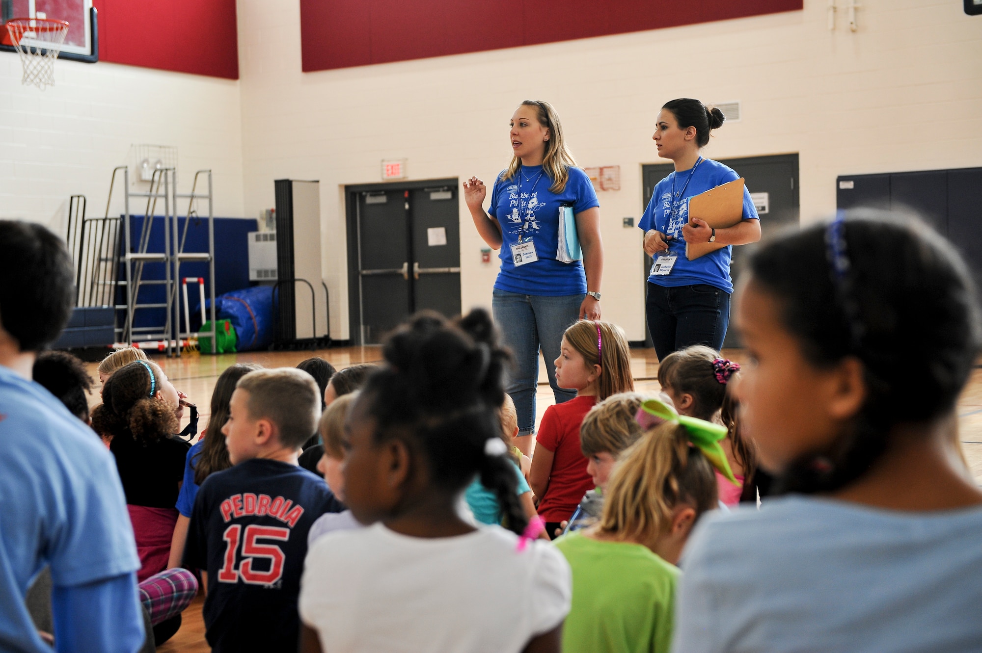 Jessica Hall, Missoula Children’s Theater tour actor director, left, and Isabella Miyares, Missoula Children’s Theater tour actor director, instruct the cast members of Blackbeard the Pirate during rehearsal, July 16, 2014, at the youth center on Buckley Air Force Base, Colo. Fourty-four children worked hard all week to present the play on Friday. (U.S. Air Force photo by Senior Airman Phillip Houk/Released)