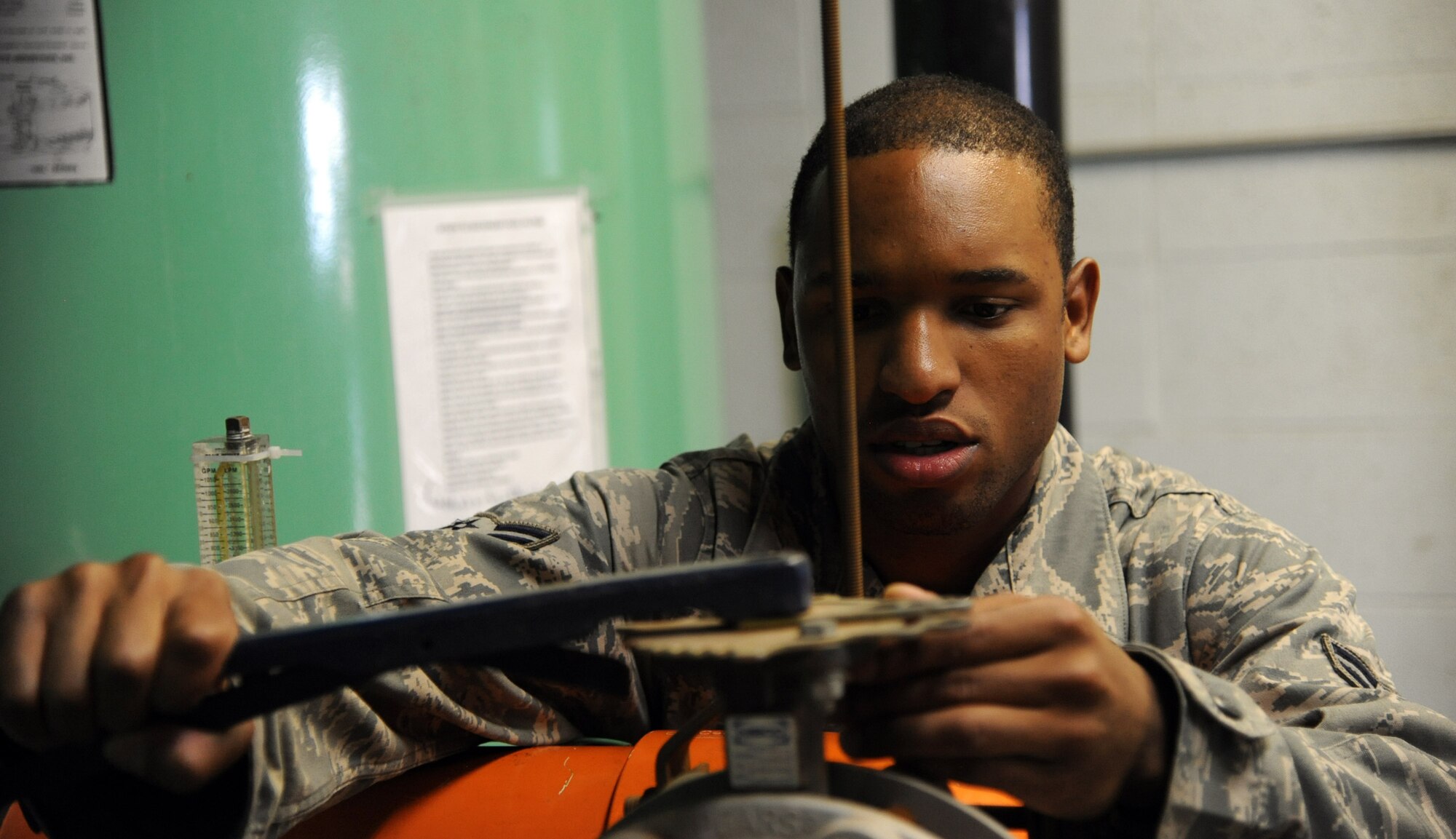 Airman 1st Class Armond Coleman, 341st Civil Engineer Squadron water and fuel system maintainer, performs a backwash July 11 at the base pool. WFSM maintain and repair 507 fire hydrants and 800 backflow prevention devices around the base and missile field. (U.S. Air Force photo/Airman 1st Class Joshua Smoot)