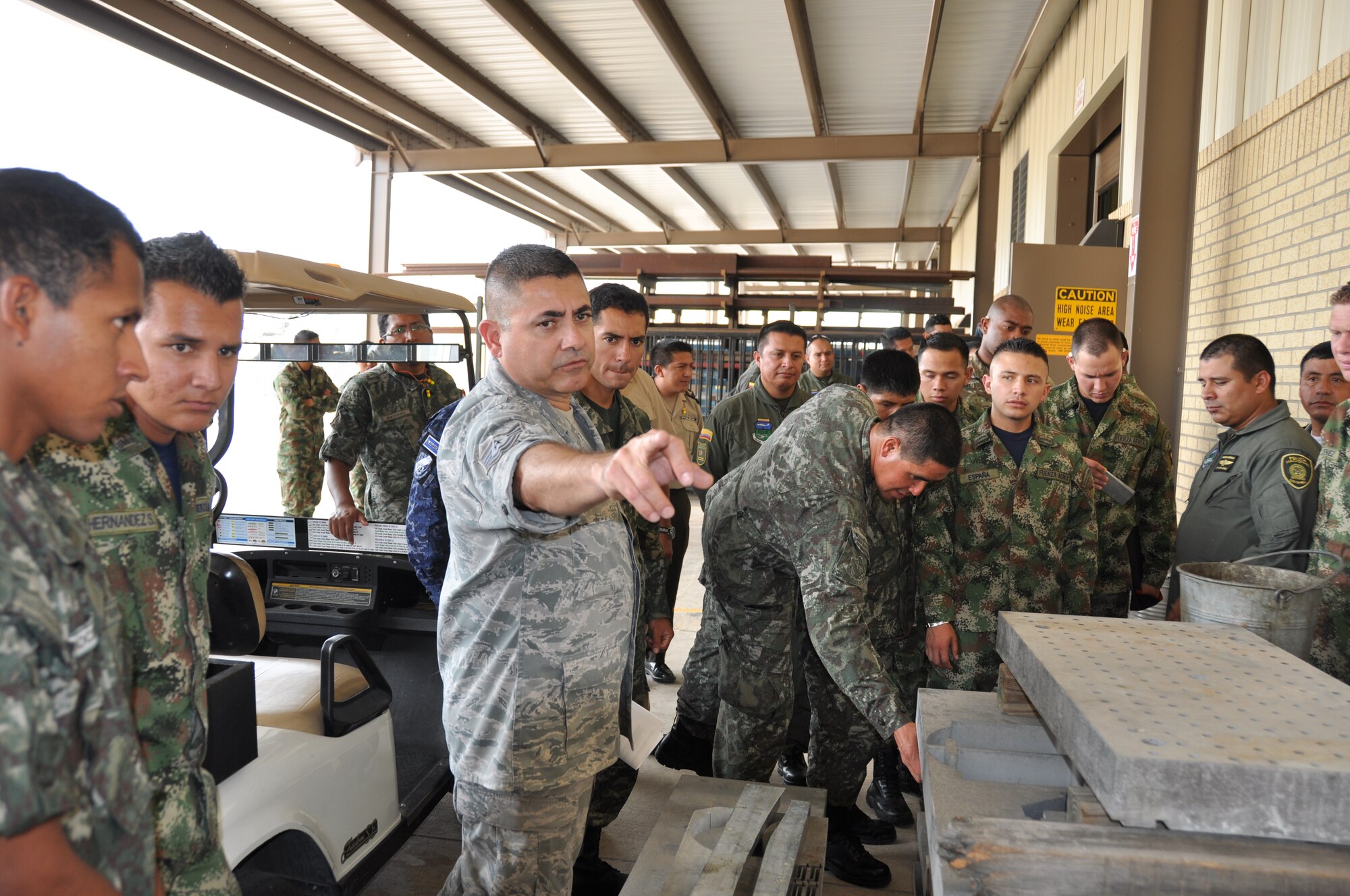 Tech Sgt. Jose Valadez, a metals technician in the 433rd Maintenance Squadron at Joint Base San Antonio-Lackland shows students from Inter-American Air Forces Academy, where the aircraft grade aluminum is kept for the C-5A Galaxy. Over 105 students from  IAAFA, JBSA-Lackland toured the 433rd Airlift Wing to learn about the C-5A Galaxy and the 433rd AW's maintenance mission. (U.S. Air Force photo by Tech Sgt. Carlos J. Trevino)