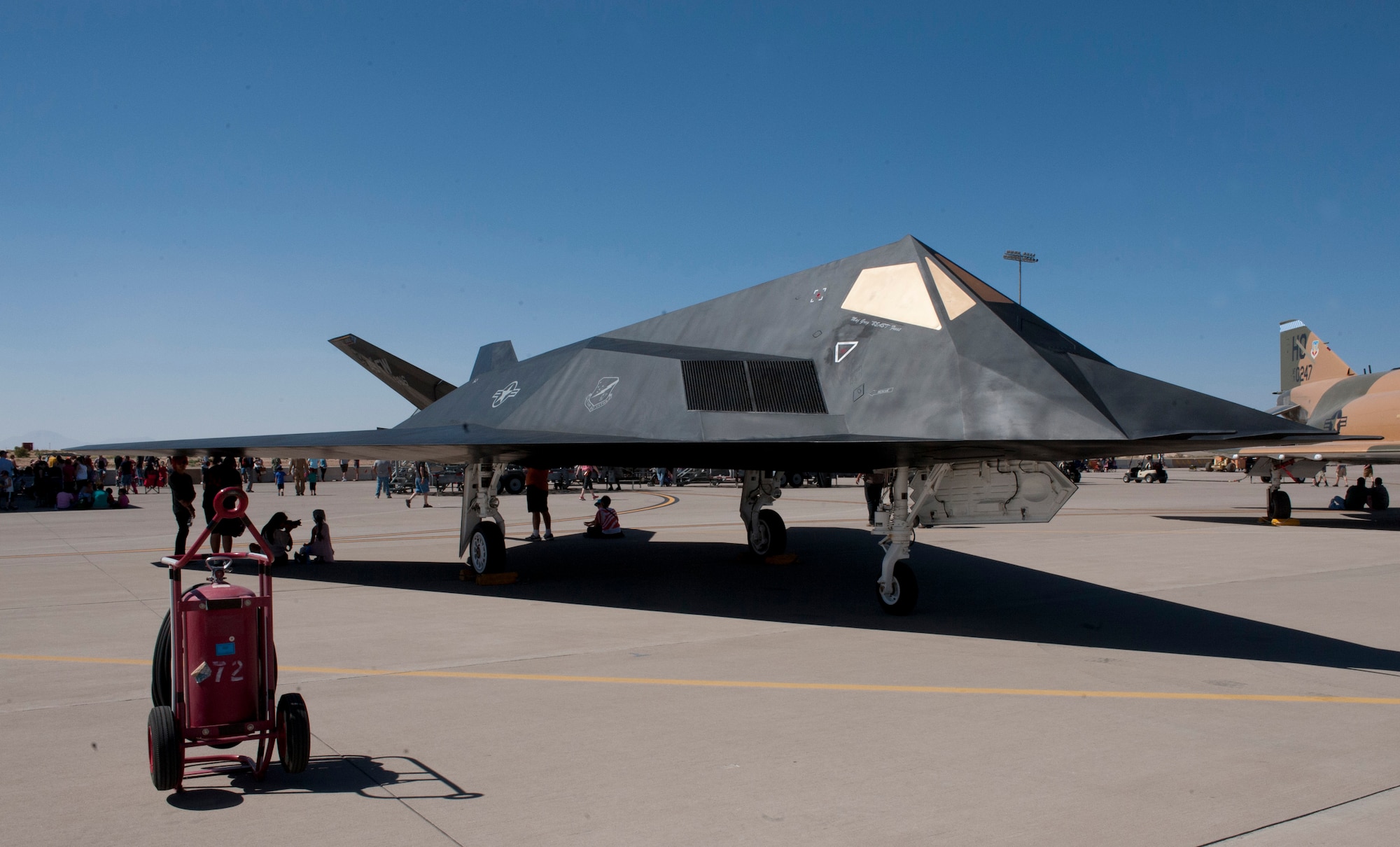 The famed F-117 Nighthawk was returned to the Holloman Heritage Park on June 28, 2014, after a 4-month restoration project. After being exposed to the elements since 2008, the aircraft was in need of repair. The 49th Maintenance Squadron returned the aircraft to the condition it was in during its stay at Holloman. The aircraft was painted to represent aircraft 793 which dropped the first bombs in Operation Iraqi Freedom. The aircraft is actually Scorpion 3, which is one of the original Senior Trend aircraft and was used to reveal the Stealth's existence to officials in December 1983 when the program was still top secret. The restored F-117, shown here, made its debut at the Holloman Open House in May 2014. (U.S. Air Force photo by Mr. Arlan Ponder)