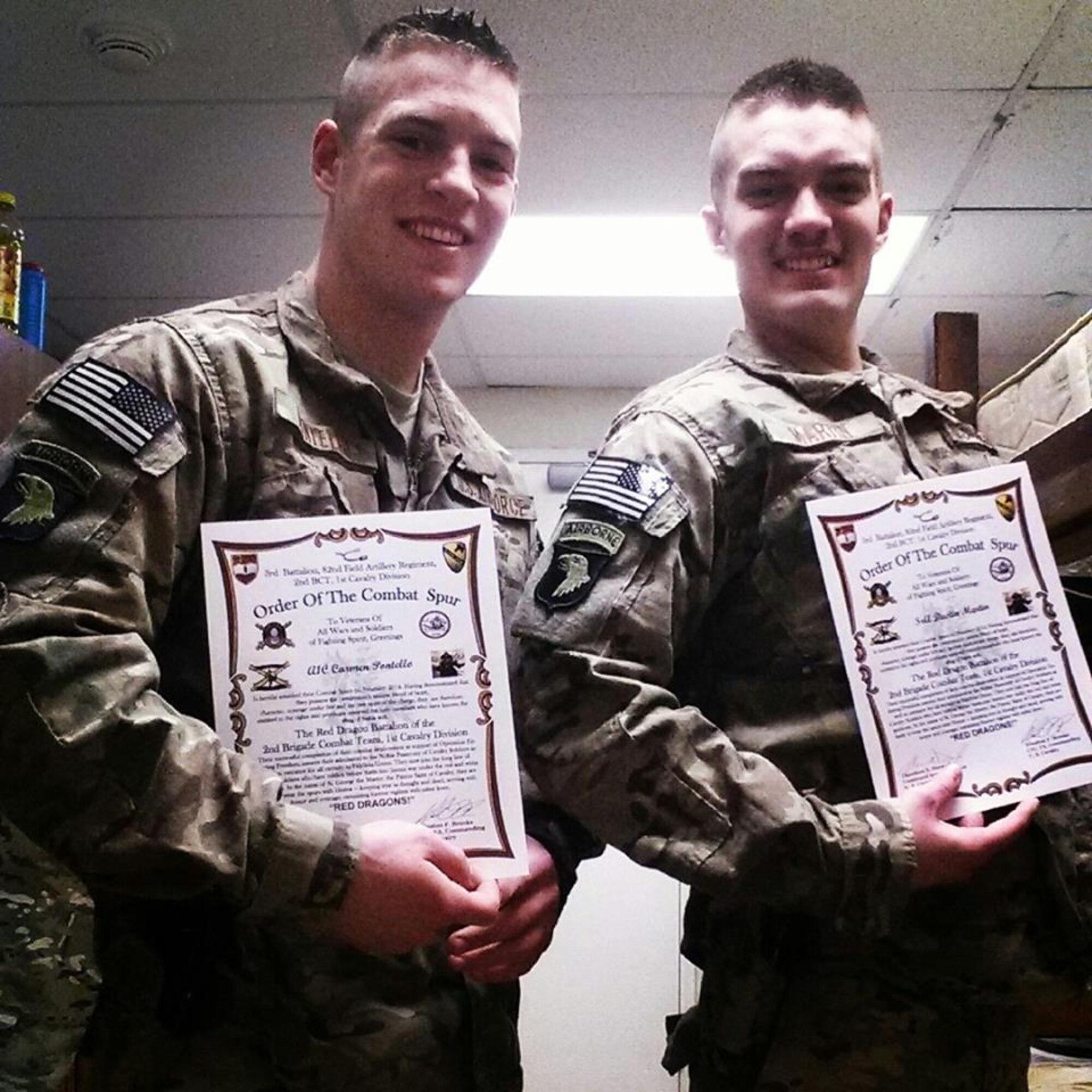 Airman 1st Class Carmen Pontello (left) and Senior Airman Dustin Martin were inducted into the Order of the Combat Spur and awarded their achievement from the U.S. Army  1st Cavalry Division. They were awarded the distinction for support during joint combat operations.  (Courtesy Photo) 