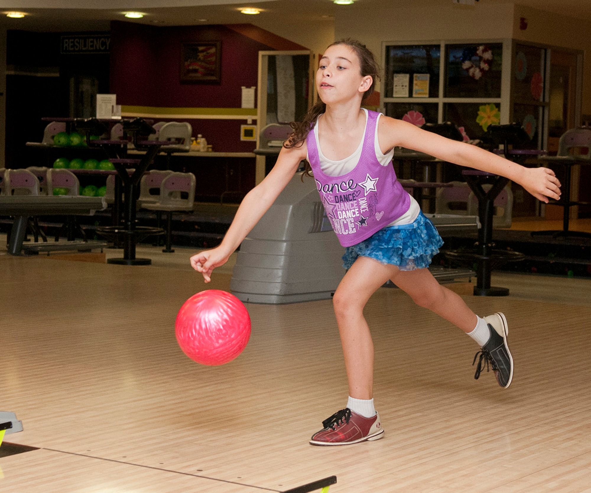 HANSCOM AIR FORCE BASE, Mass. – MacKenna Bonner enjoys a game of bowling with her family during the “3for U Thursdays” bowling special at the Hanscom Lanes Bowling Center July 17. The Hanscom community is invited to bowl between 12 noon to 3 p.m. every Thursday for $3 per game, includes show rental, throughout the summer. (U.S. Air Force photo by Mark Wyatt)