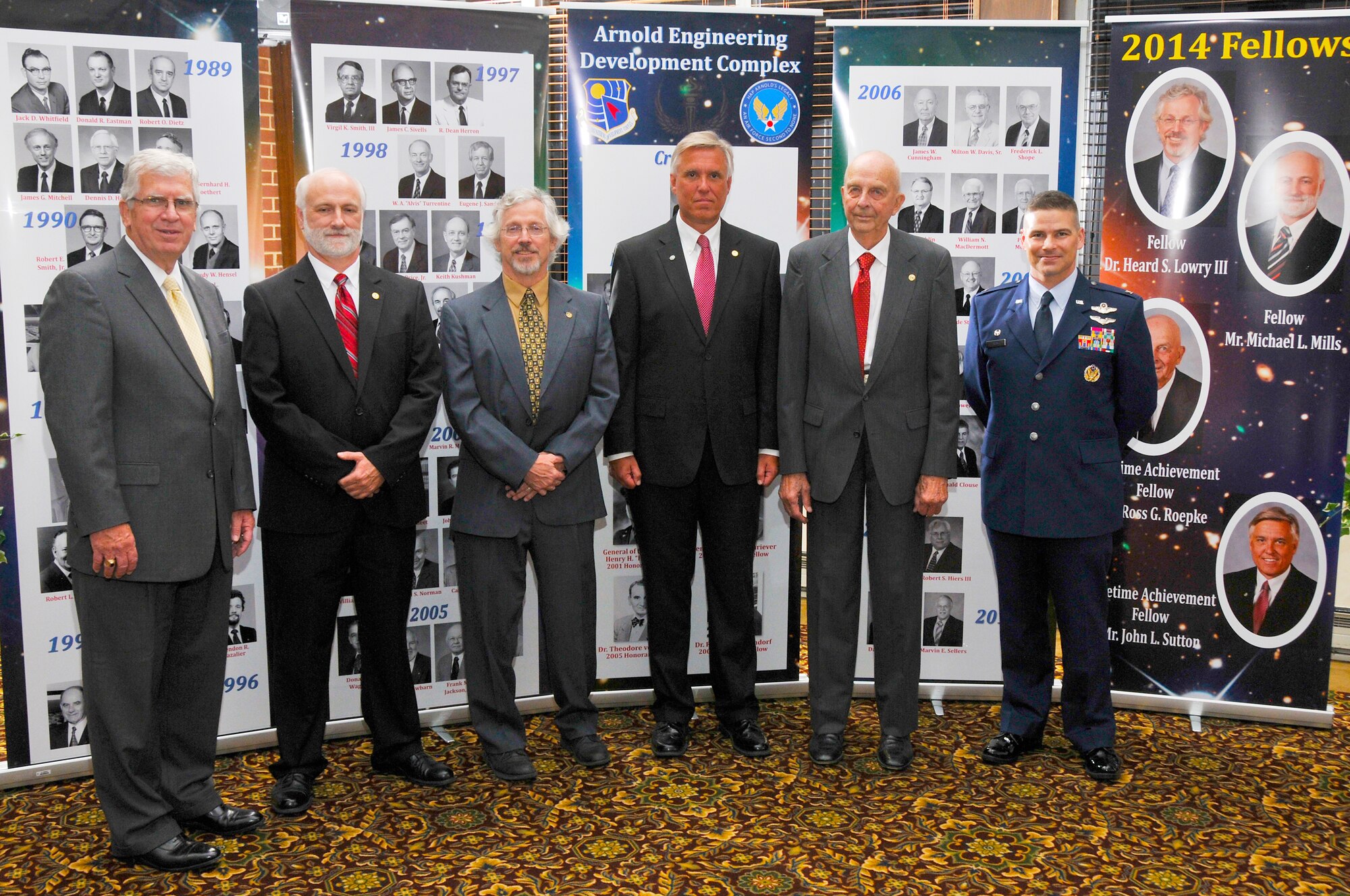 Pictured here at the Arnold Engineering Development Complex (AEDC) Fellows Banquet, left to right, is AEDC Chief Technologist Dr. Edward Kraft, 2014 AEDC Fellow Michael Mills and 2014 AEDC Fellow Dr. Heard Lowry, 2014 AEDC Lifetime Achievement Fellow John Sutton, 2014 AEDC Lifetime Achievement Fellow Ross Roepke and AEDC Commander Col. Raymond Toth. 
