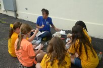U.S Air Force Staff Sgt. Monique Hunter, Air Education and Training Command, speaks about and demonstrates from biblical stories and methods used to students, during vacation bible school  June 26 at Joint Base San Antonio-Randolph. (U.S. Air Force photo by Joel Martinez/Released)