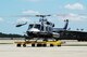 Members from the National Nuclear Security Administration and 79th Medical Wing take flight on Joint Base Andrews, Maryland, July 17, 2014. They flew in a Bell 412 helicopter operated by the Remote Sensing Laboratory Aerial Measuring System during an aerial radiation assessment survey. The aerial mission uses aircraft equipped with radiation sensing technology that gathers data that can be used in the event of a radiological event. (U.S. Air Force photo/Staff Sgt. Matt Davis)