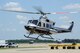 Members from the National Nuclear Security Administration and 79th Medical Wing take flight on Joint Base Andrews, Maryland, July 17, 2014. They flew in a Bell 412 helicopter operated by the Remote Sensing Laboratory Aerial Measuring System during an aerial radiation assessment survey. The aerial mission uses aircraft equipped with radiation sensing technology that gathers data that can be used in the event of a radiological event. (U.S. Air Force photo/Staff Sgt. Matt Davis)