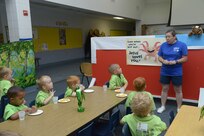 Patti Schnaubect, instructor, tells biblical stories to pre-school students during vacation bible school  June 26 at Joint Base San Antonio-Randolph.  Schnaubect has instructed at VBS for 11 years. (U.S. Air Force photo by Joel Martinez/Released)
